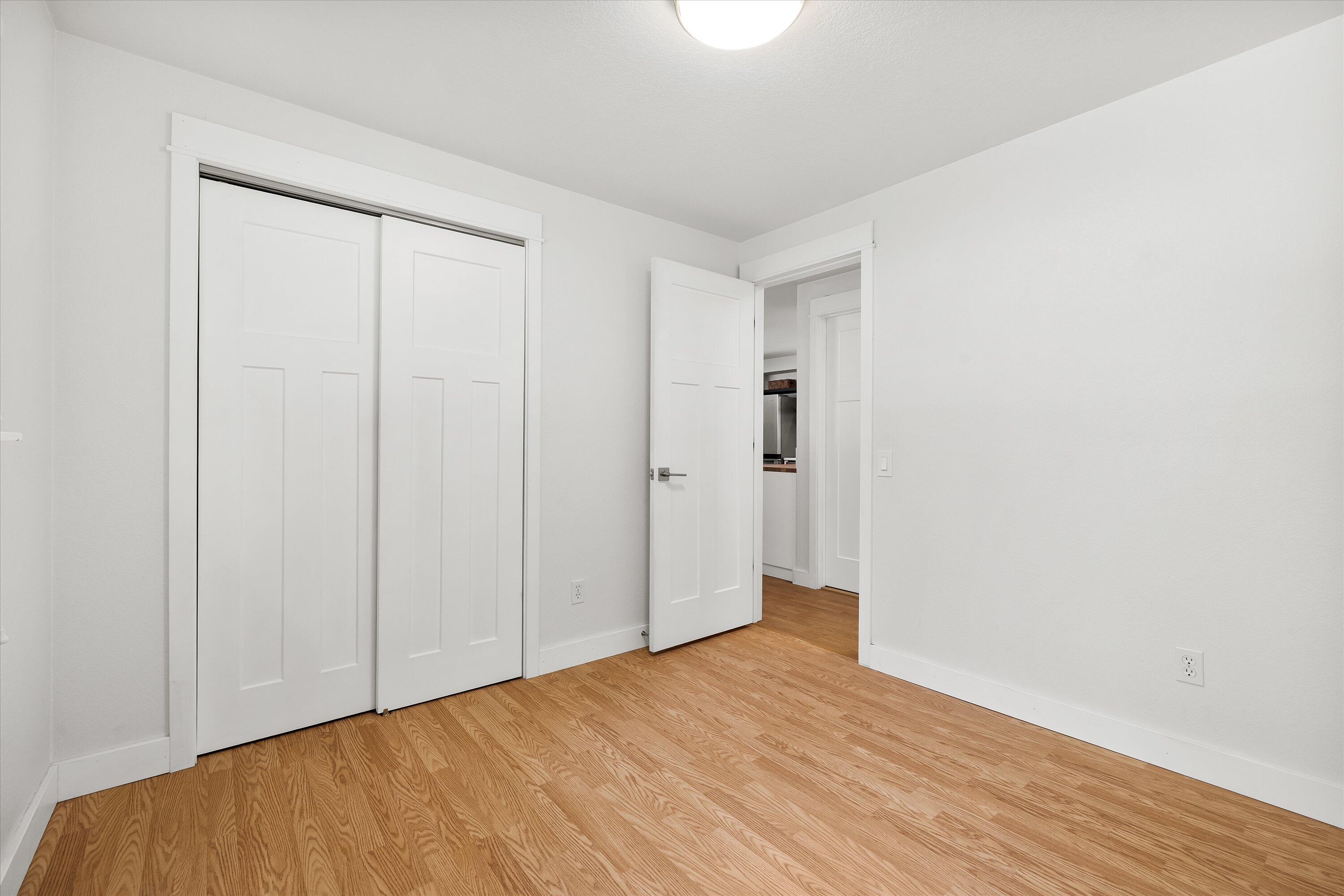 63634 Hunters Circle Bend, OR 97701 - Photo 16 of 28 a view of an empty room with wooden floor