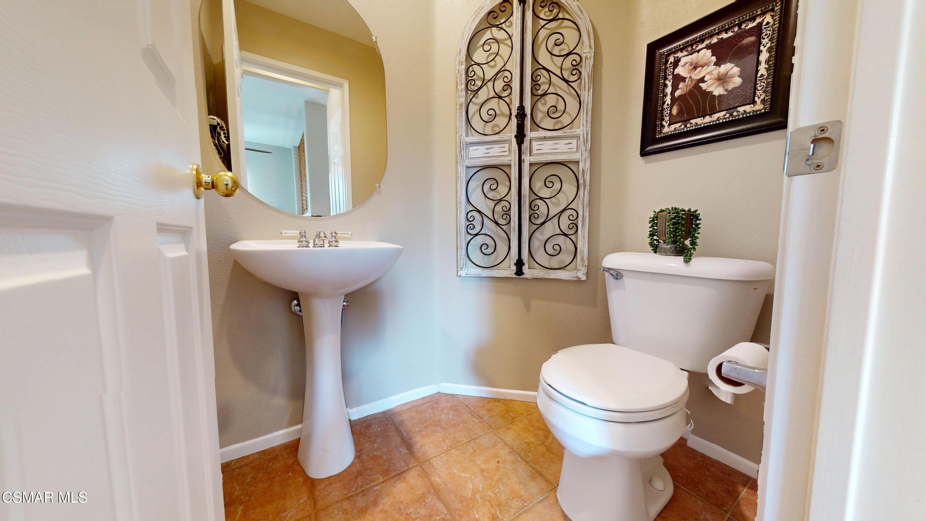 1708 Starpine Way Simi Valley, CA 93065 - Photo 11 of 60 a bathroom with a toilet sink and mirror