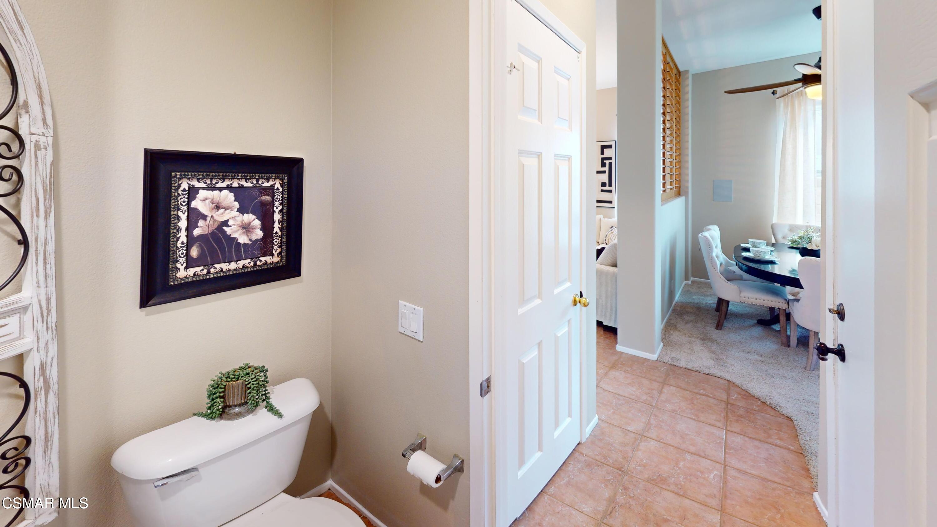 1708 Starpine Way Simi Valley, CA 93065 - Photo 13 of 60 a bathroom with a toilet a sink and a mirror