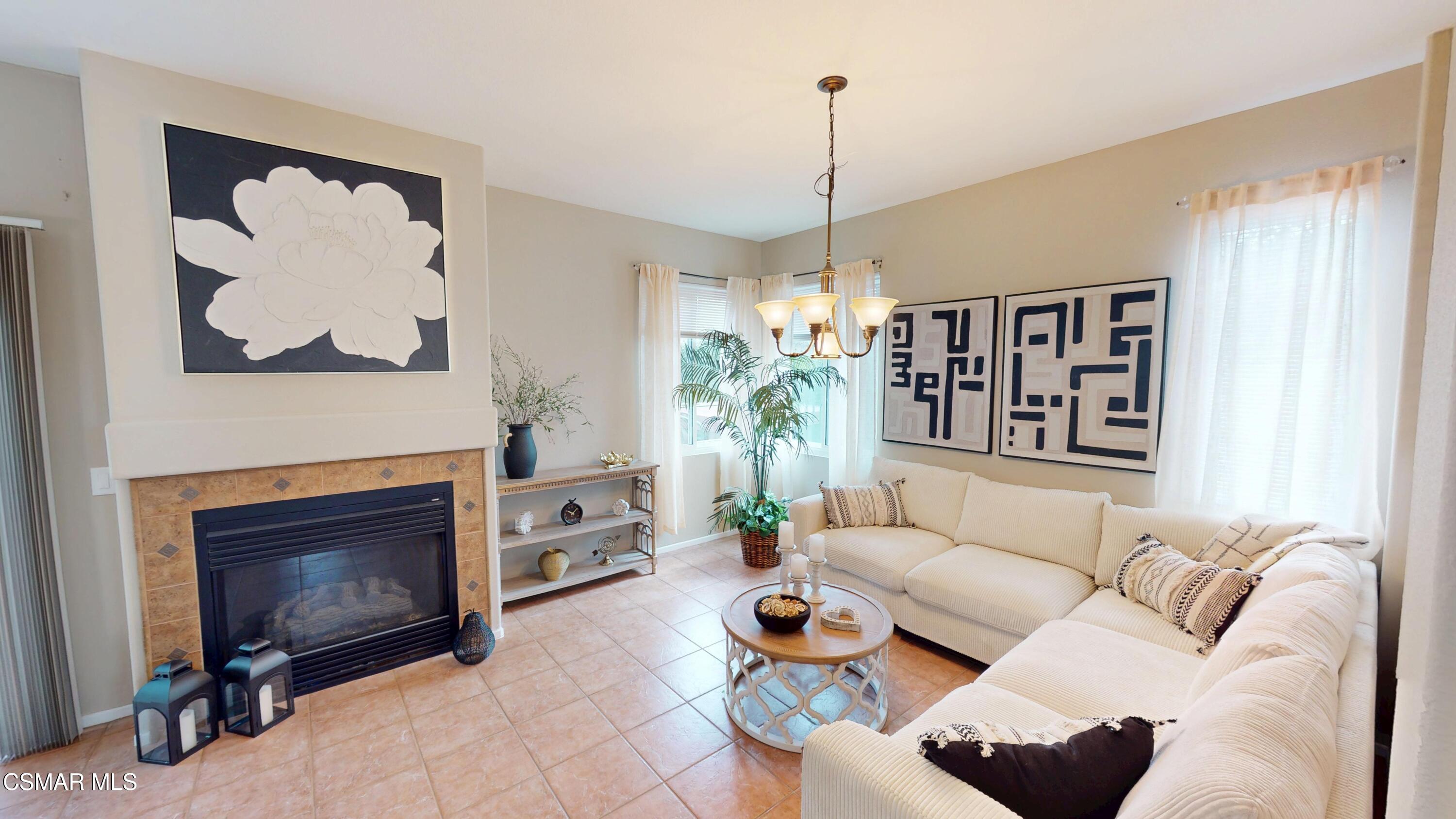 1708 Starpine Way Simi Valley, CA 93065 - Photo 16 of 60 a living room with furniture a window and a fireplace