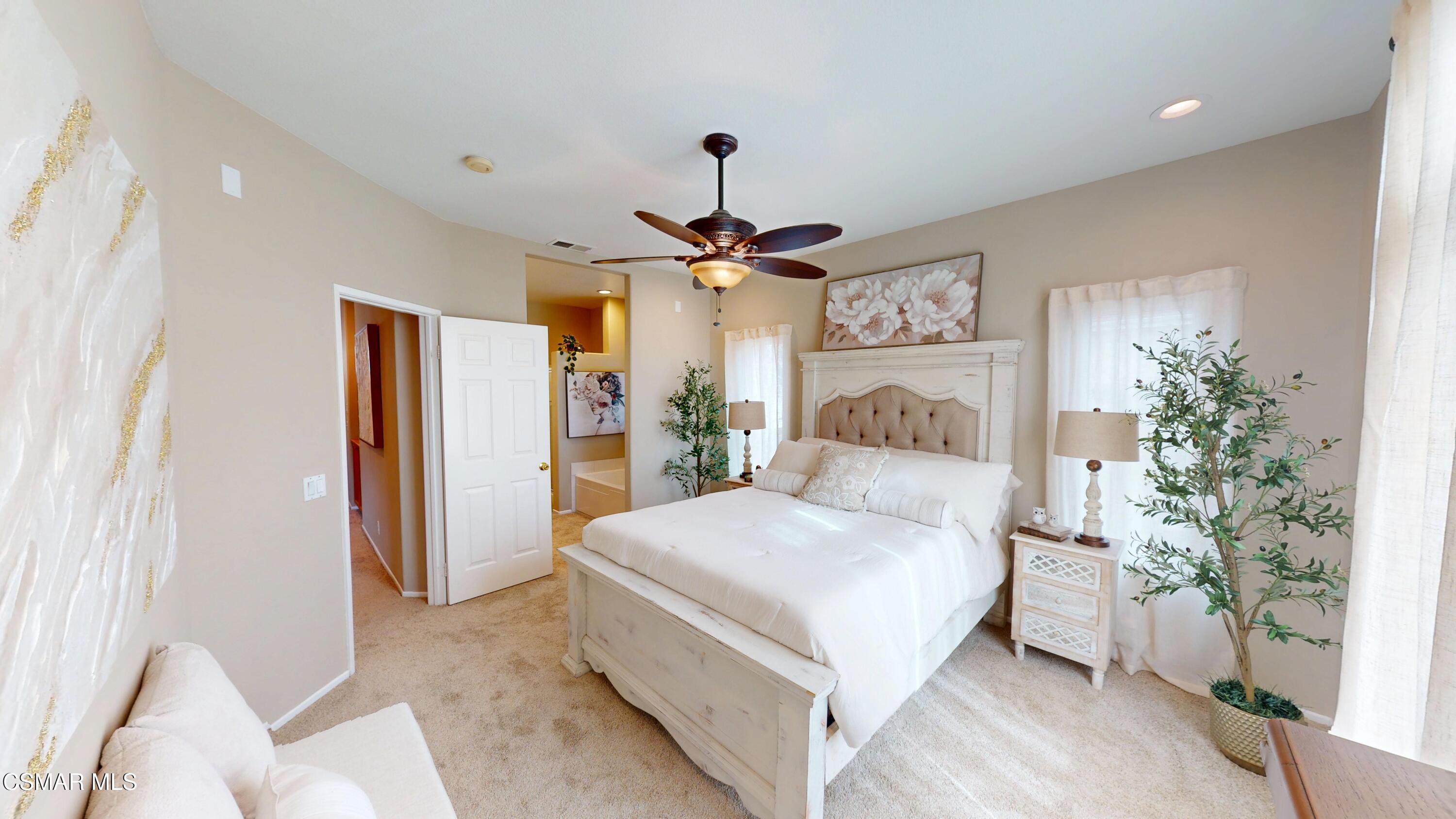 1708 Starpine Way Simi Valley, CA 93065 - Photo 30 of 60 a bedroom with a large bed and a chandelier