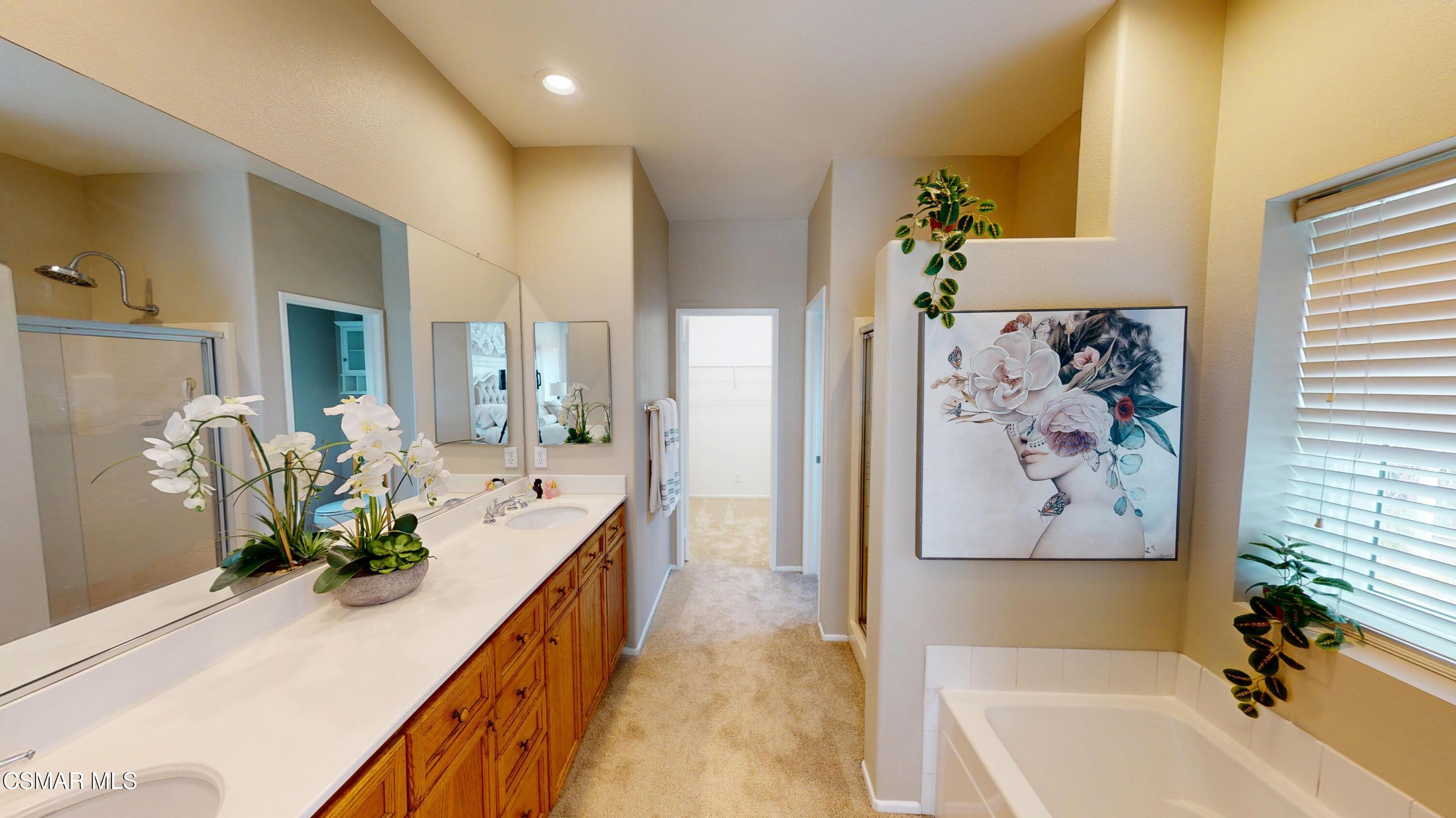 1708 Starpine Way Simi Valley, CA 93065 - Photo 33 of 60 a bath room with a bathtub and a double vanity sink
