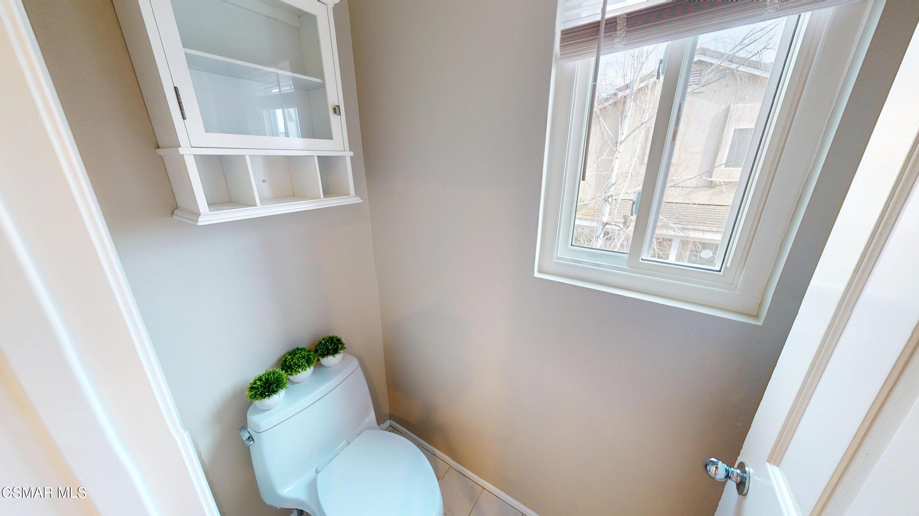 1708 Starpine Way Simi Valley, CA 93065 - Photo 35 of 60 a white toilet sitting next to a window and a wooden floor