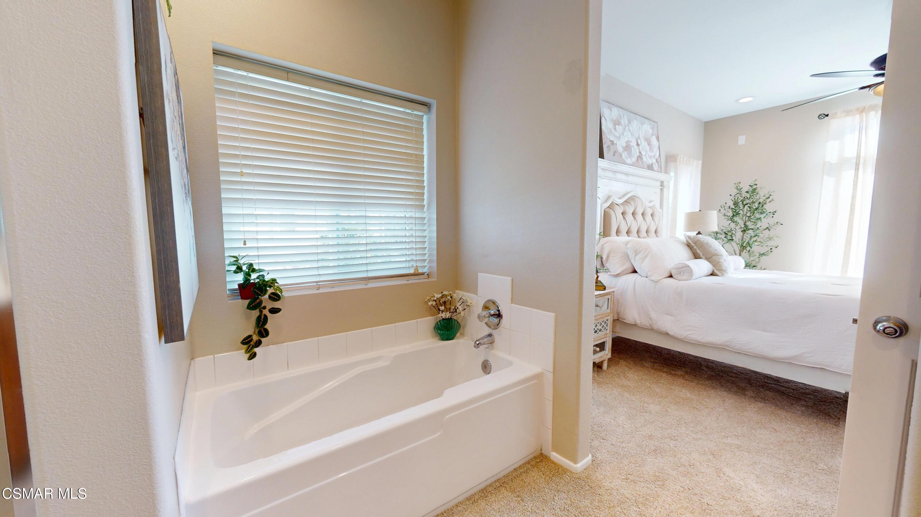 1708 Starpine Way Simi Valley, CA 93065 - Photo 38 of 60 a bathroom with a bathtub and a window