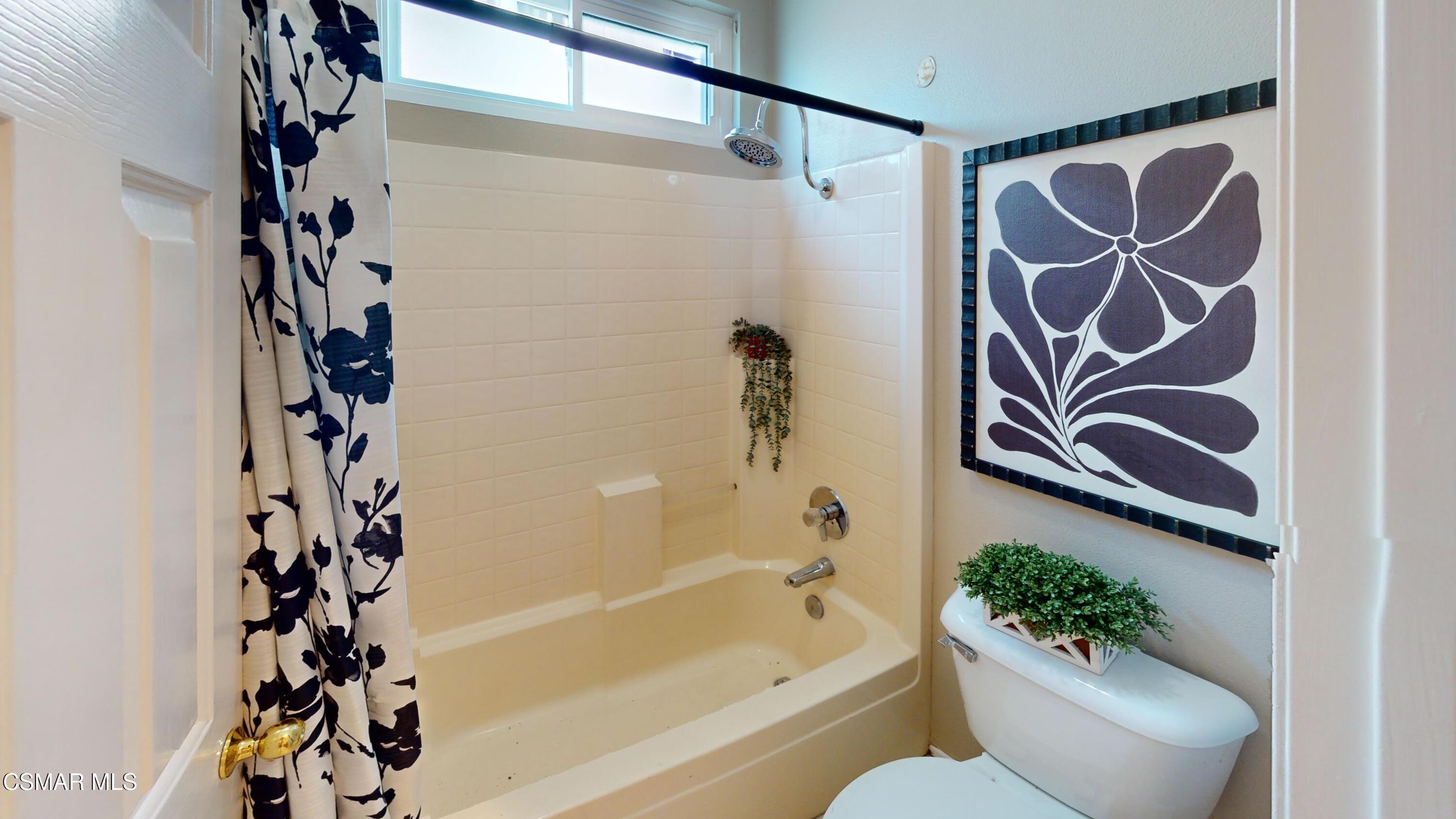 1708 Starpine Way Simi Valley, CA 93065 - Photo 47 of 60 a bathroom with a bathtub and shower curtain