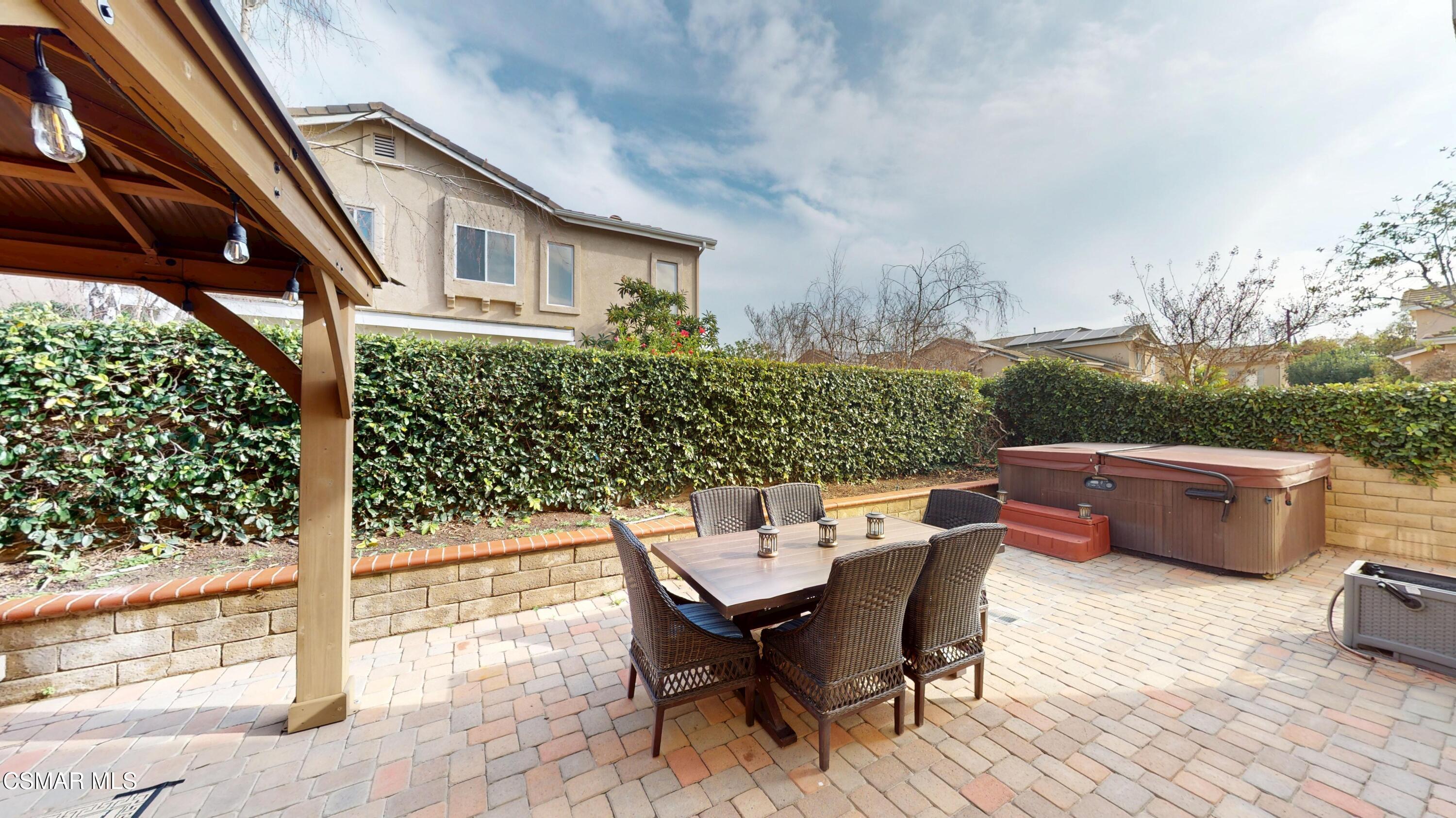 1708 Starpine Way Simi Valley, CA 93065 - Photo 51 of 60 a view of a patio with a table and chairs
