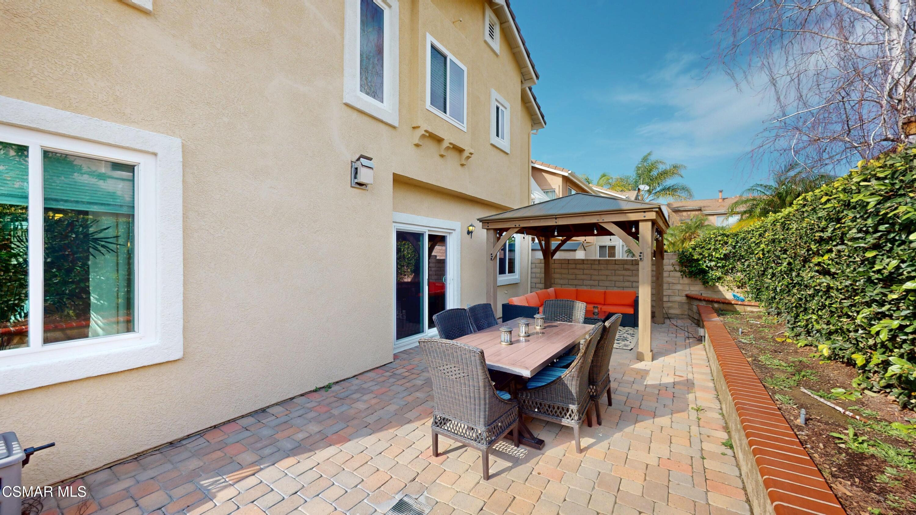 1708 Starpine Way Simi Valley, CA 93065 - Photo 54 of 60 a view of a patio with a table and chairs