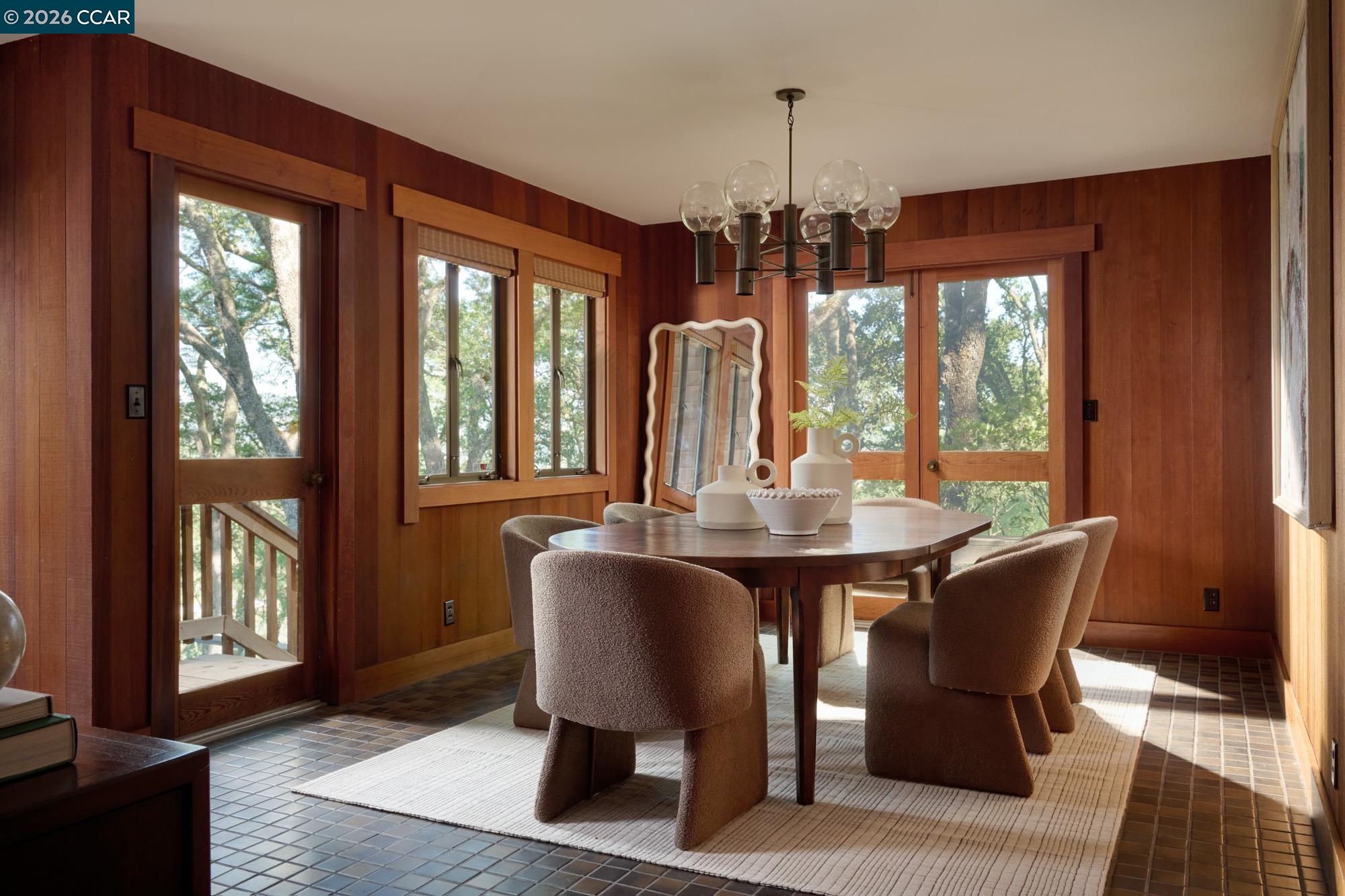 289 Castle Crest Road Alamo, CA 94507 - Photo 15 of 57 a dining room with furniture a chandelier and wooden floor