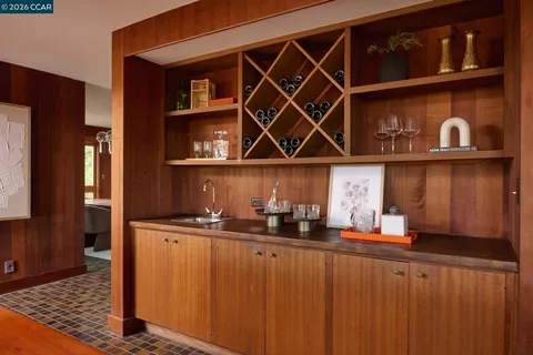 a kitchen with cabinets and stainless steel appliances