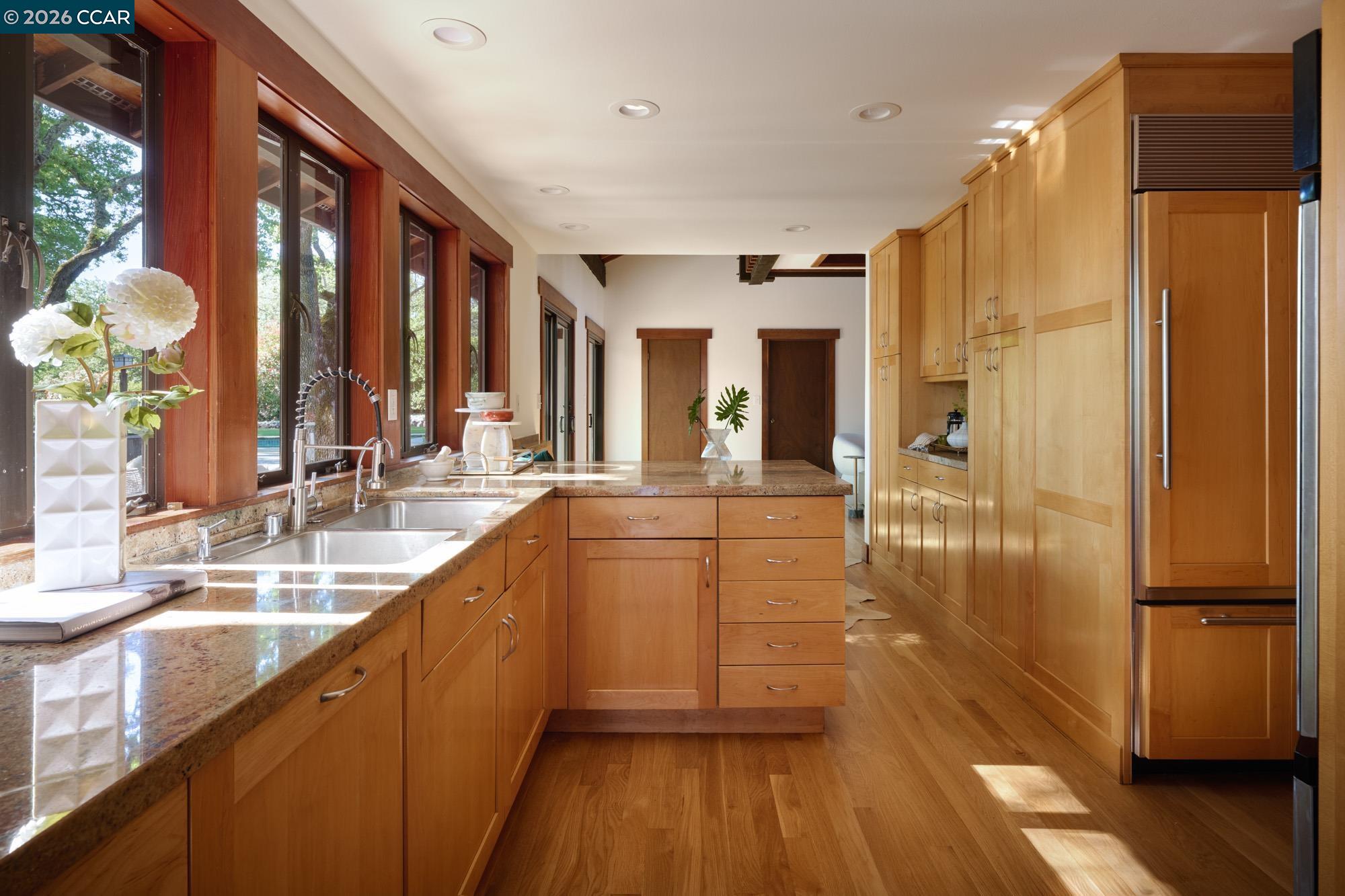289 Castle Crest Road Alamo, CA 94507 - Photo 17 of 57 a kitchen with counter top space and wooden floor