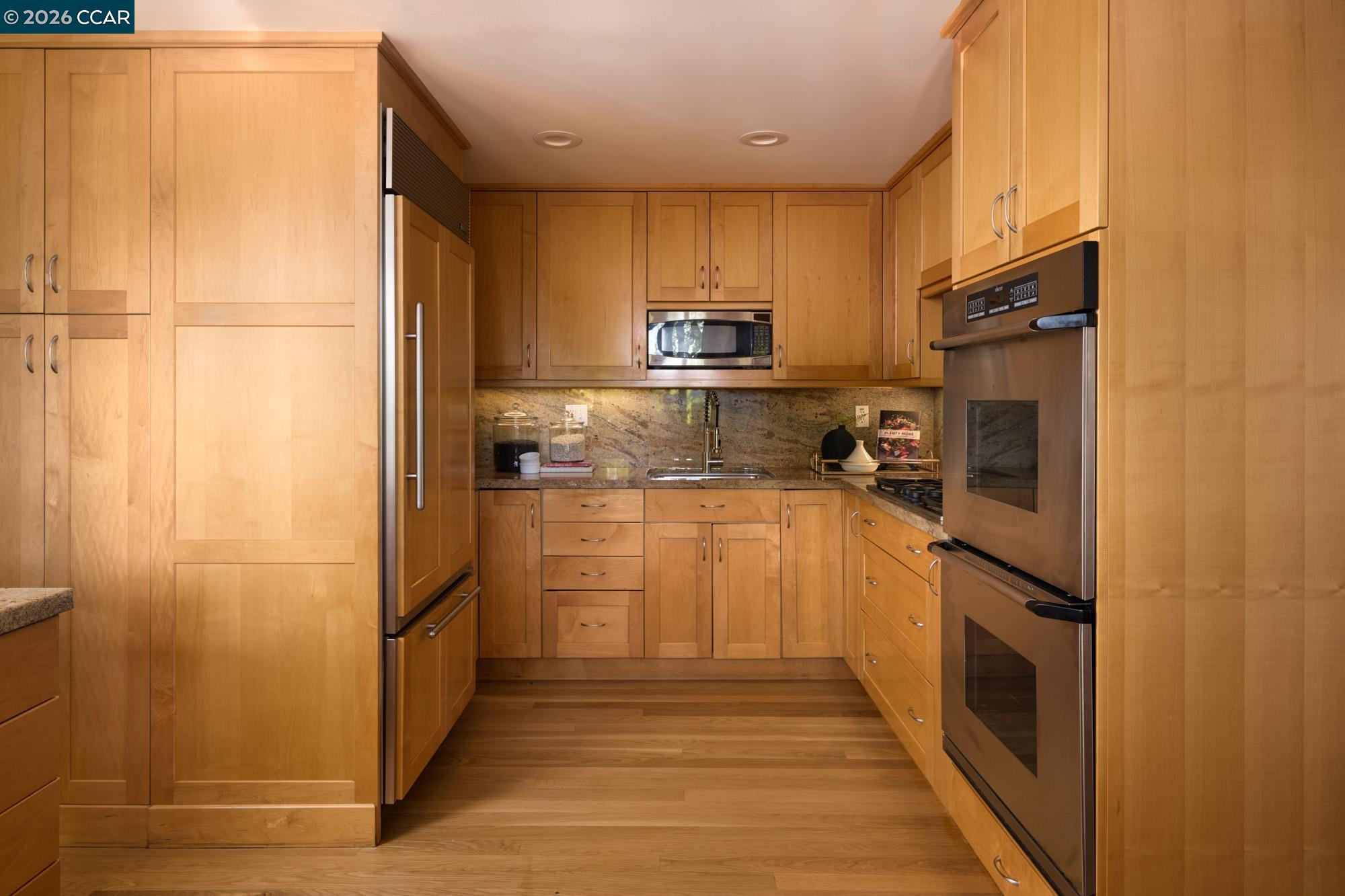 289 Castle Crest Road Alamo, CA 94507 - Photo 19 of 57 a kitchen with cabinets and stainless steel appliances