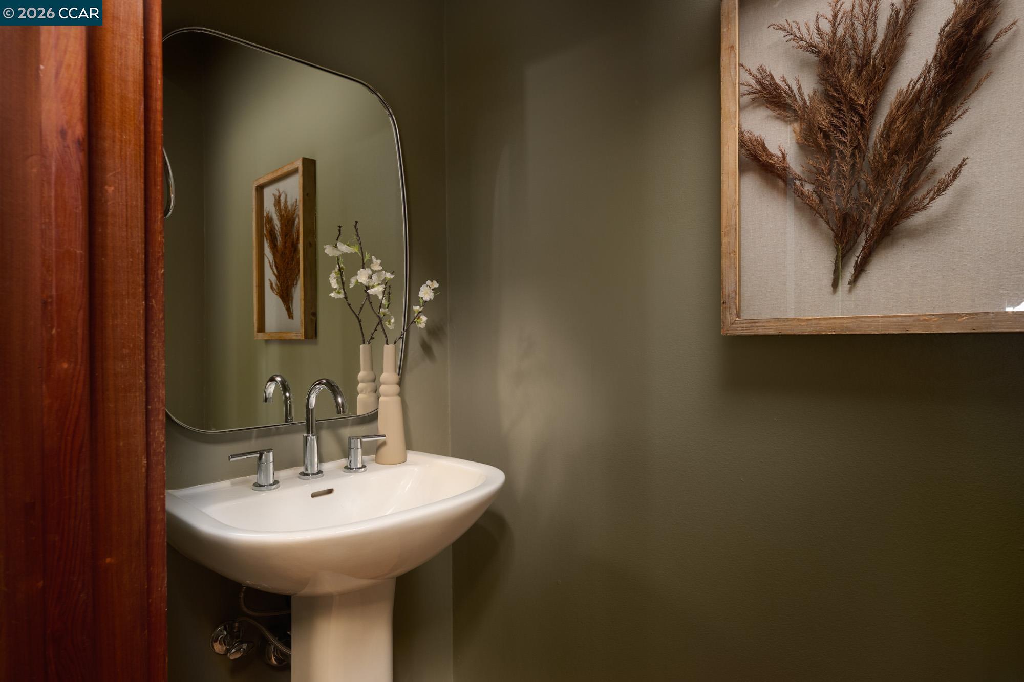 289 Castle Crest Road Alamo, CA 94507 - Photo 25 of 57 a bathroom with a sink and a mirror