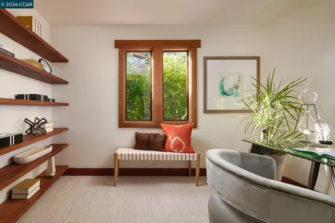 a view of a hallway with wooden floor and stairs