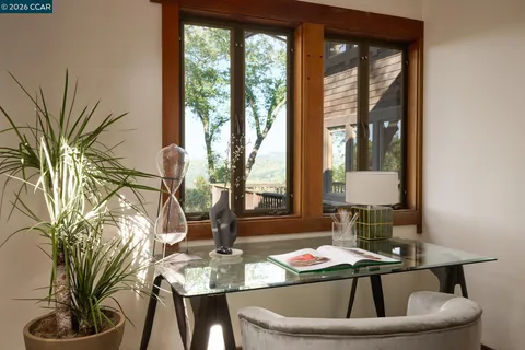 a view of livingroom with furniture and windows