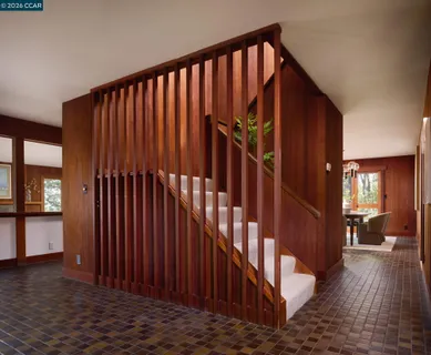 a bedroom with a bed and a fireplace