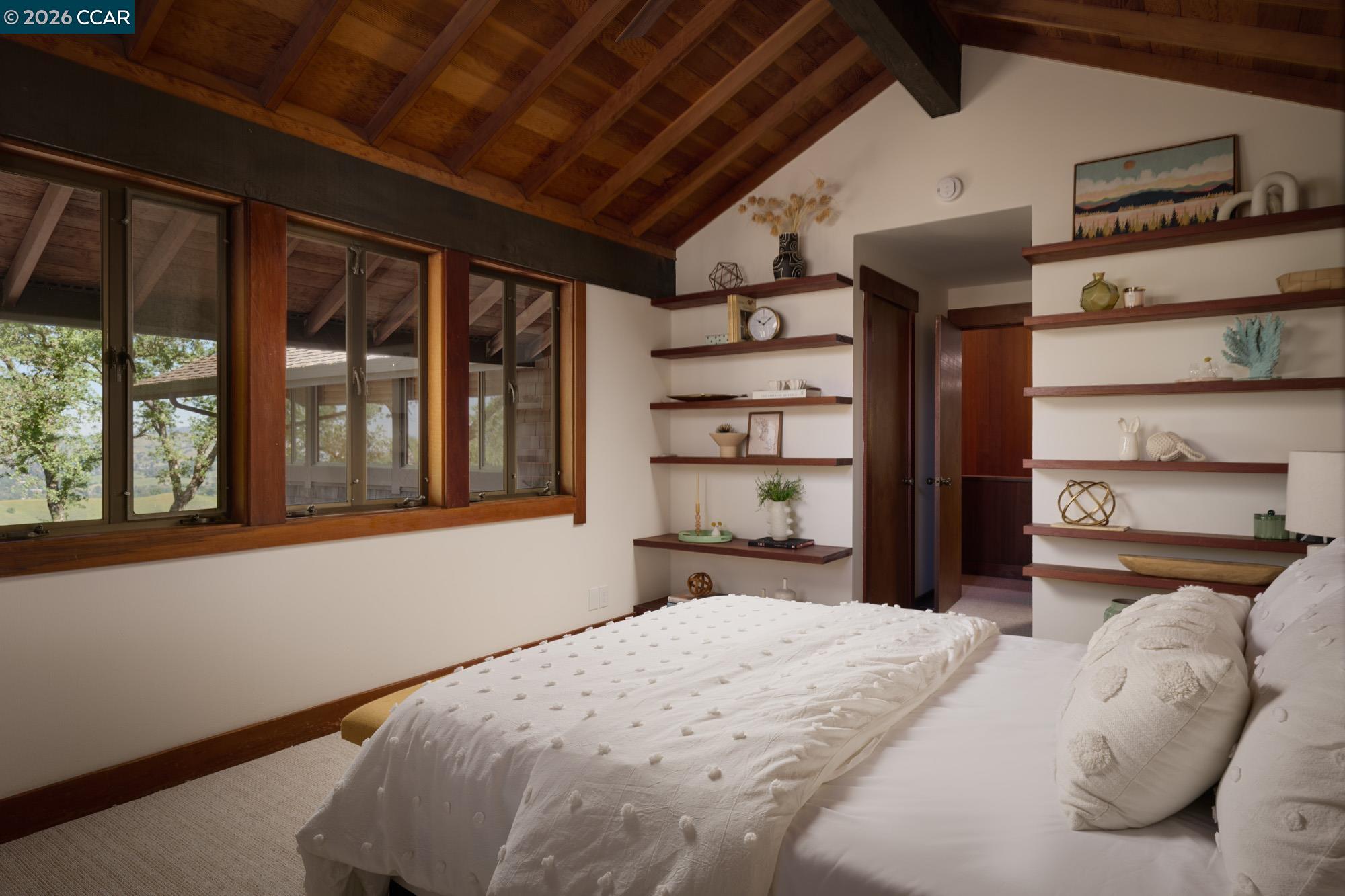 289 Castle Crest Road Alamo, CA 94507 - Photo 40 of 57 a bedroom with a bed and a large window