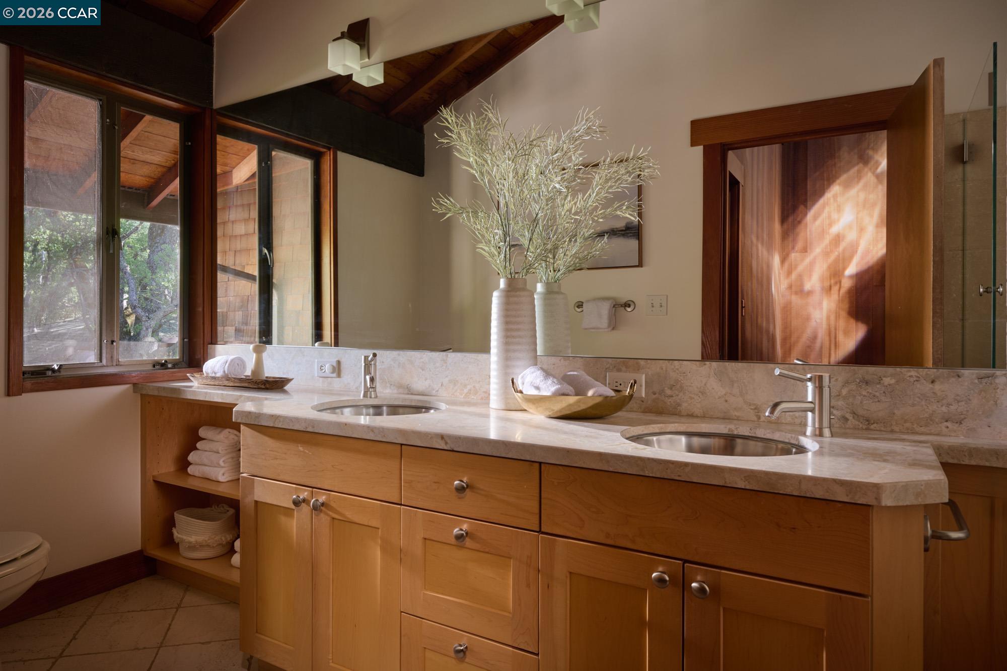289 Castle Crest Road Alamo, CA 94507 - Photo 41 of 57 a bathroom with a double vanity sink and a mirror