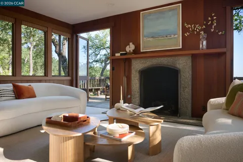 a balcony with wooden floor and fence