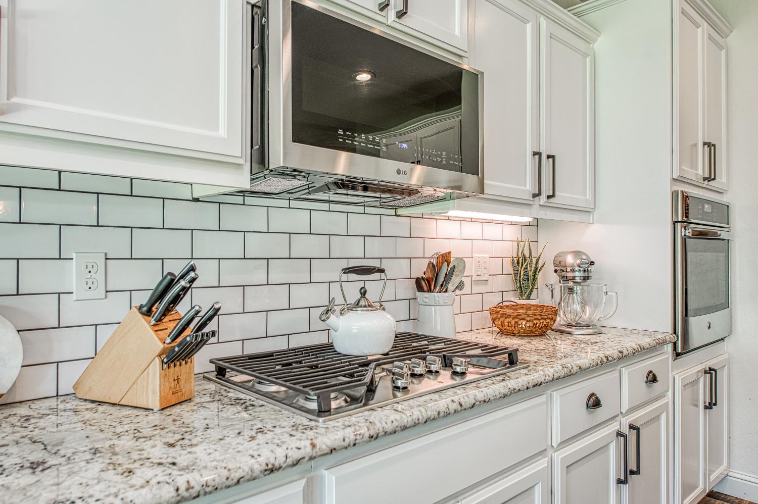 753 East Aretha Avenue Fowler, CA 93625 - Photo 19 of 61 a kitchen with a washing machine and cabinets