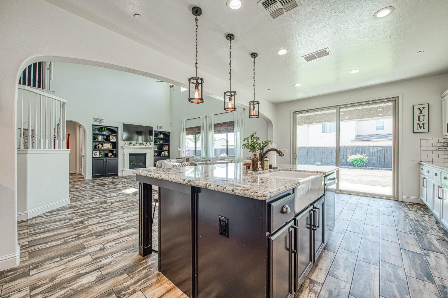 753 East Aretha Avenue Fowler, CA 93625 - Photo 21 of 61 a kitchen with stainless steel appliances granite countertop counter space and wooden floor