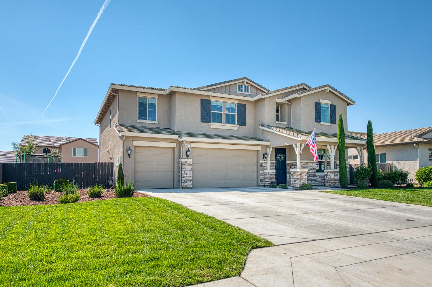 753 East Aretha Avenue Fowler, CA 93625 - Photo 3 of 61 a front view of a house with a yard