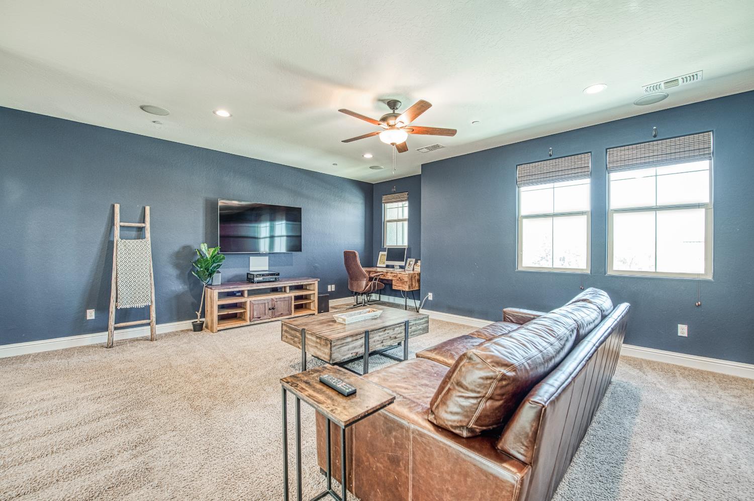 753 East Aretha Avenue Fowler, CA 93625 - Photo 35 of 61 a living room with furniture and a flat screen tv