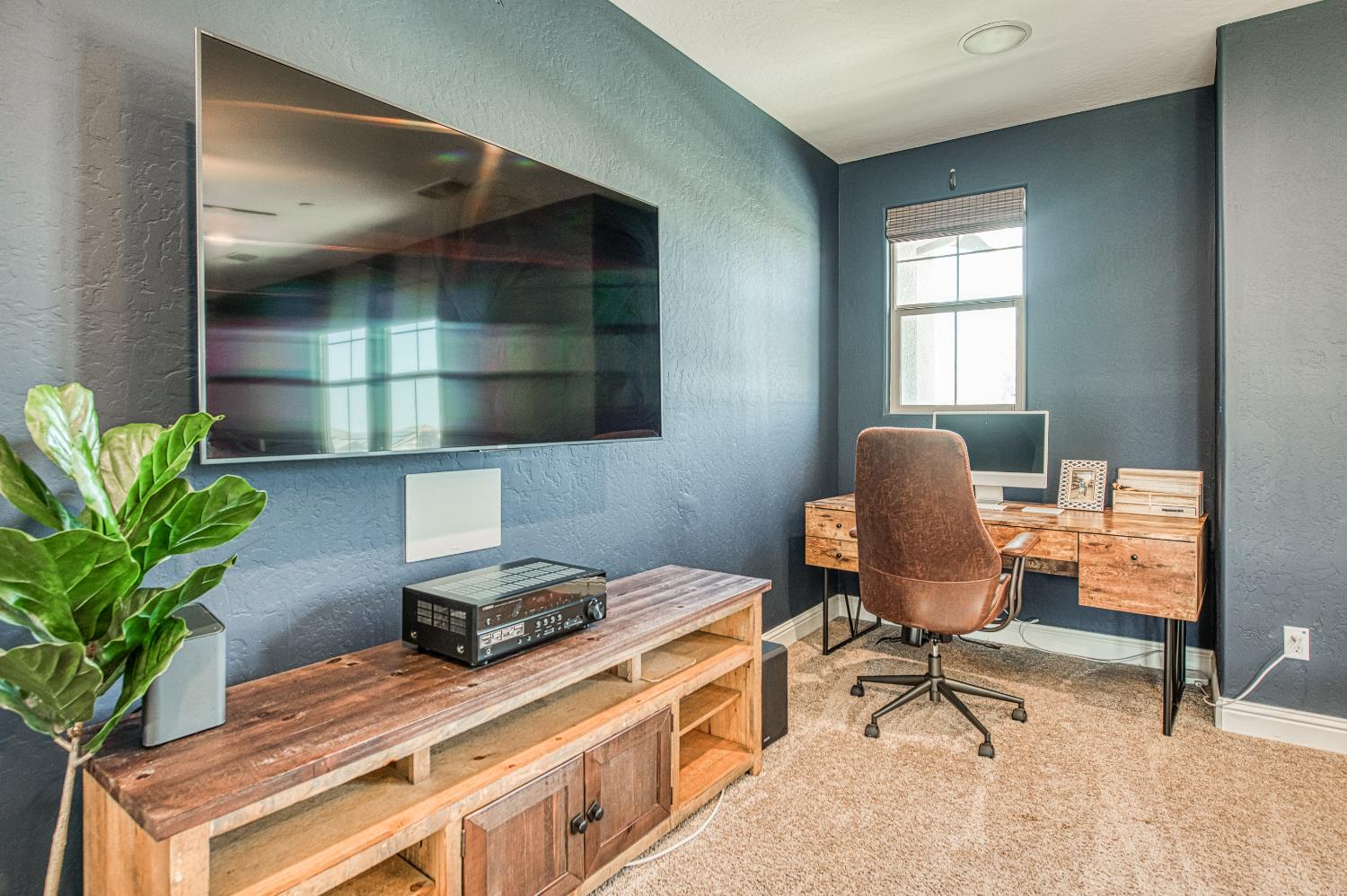 753 East Aretha Avenue Fowler, CA 93625 - Photo 37 of 61 a workspace with furniture and a potted plant