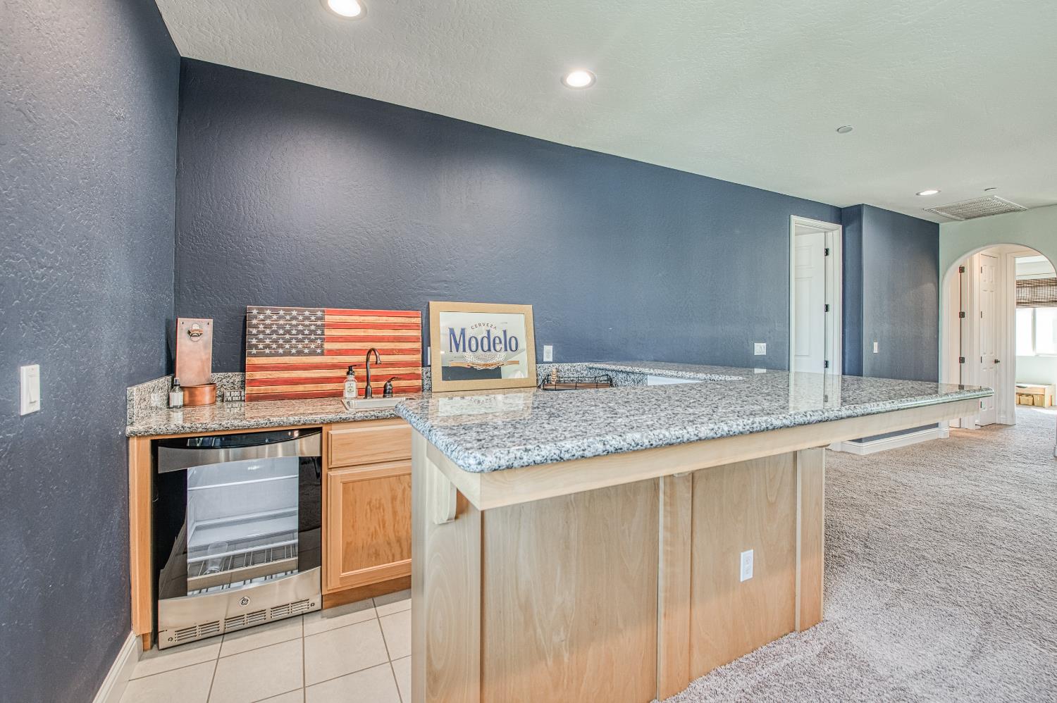 753 East Aretha Avenue Fowler, CA 93625 - Photo 39 of 61 a kitchen with stainless steel appliances granite countertop a sink and a stove