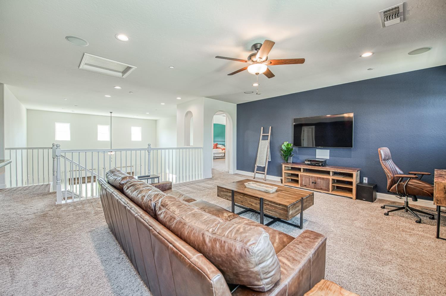 753 East Aretha Avenue Fowler, CA 93625 - Photo 40 of 61 a living room with furniture and a flat screen tv