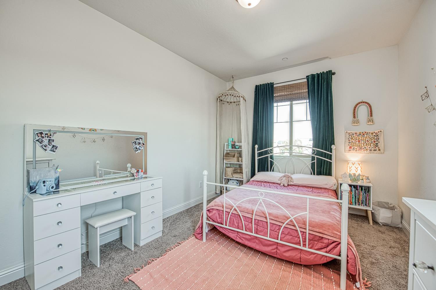 753 East Aretha Avenue Fowler, CA 93625 - Photo 42 of 61 a bedroom with a bed and a dresser