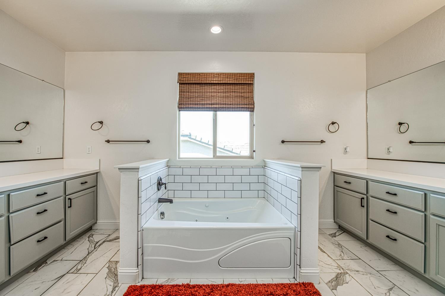 753 East Aretha Avenue Fowler, CA 93625 - Photo 47 of 61 a bathroom with a bathtub sink and mirror