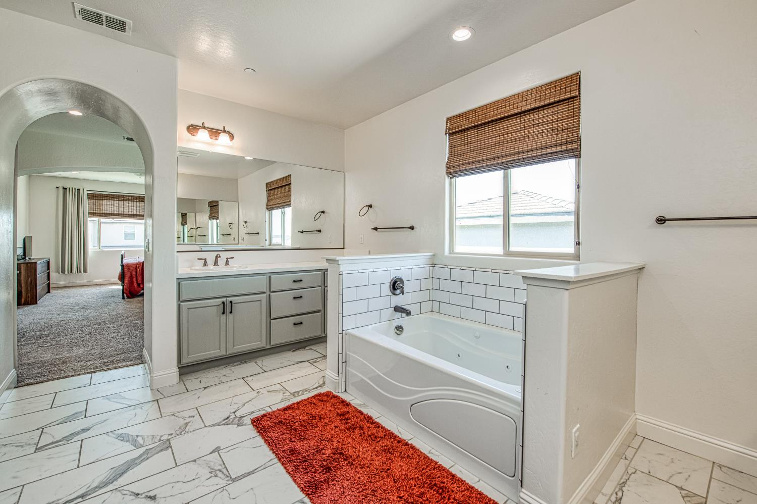 753 East Aretha Avenue Fowler, CA 93625 - Photo 48 of 61 a bathroom with a bathtub sink and mirror