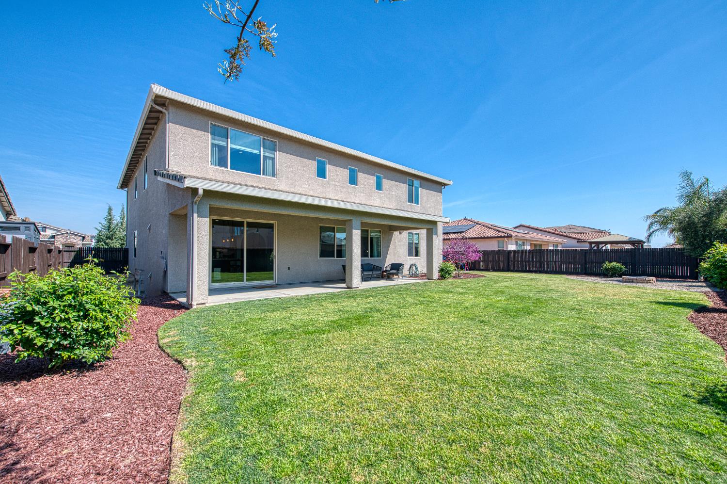 753 East Aretha Avenue Fowler, CA 93625 - Photo 55 of 61 a front view of a house with a yard and garage
