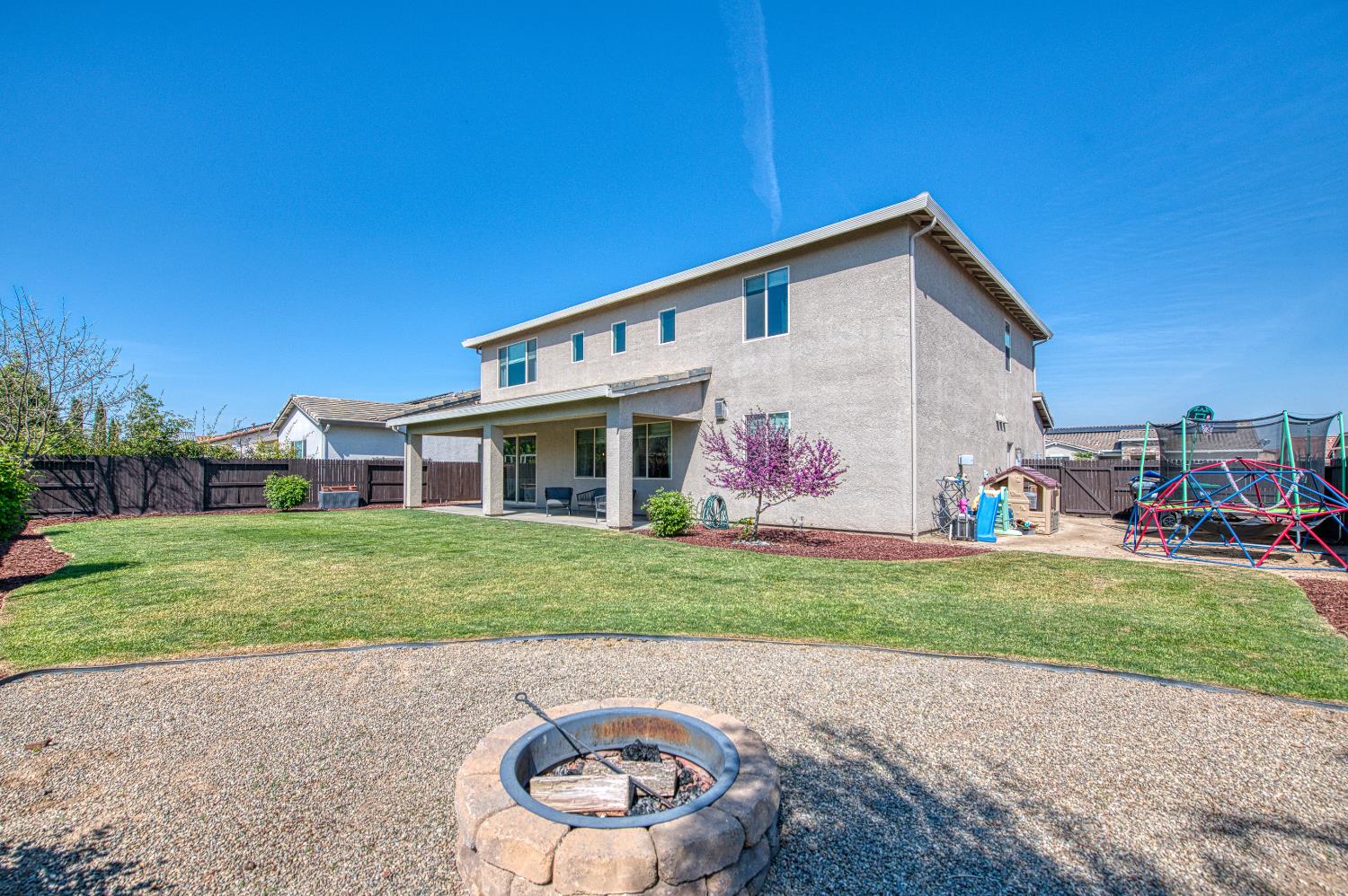 753 East Aretha Avenue Fowler, CA 93625 - Photo 58 of 61 a front view of a house with a yard and garage