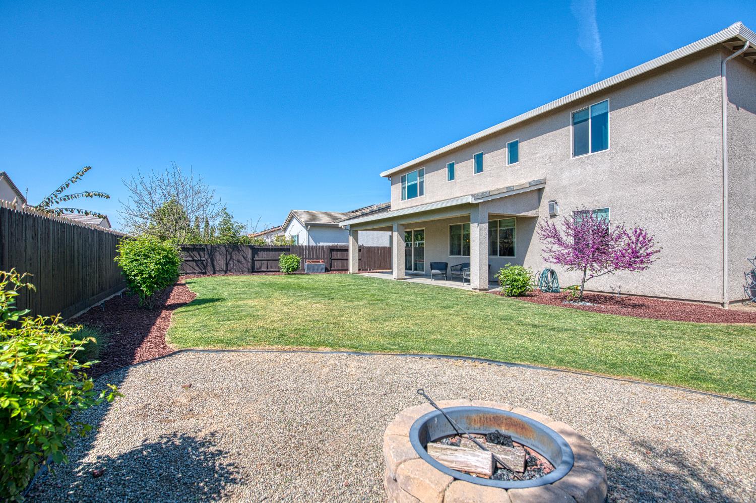 753 East Aretha Avenue Fowler, CA 93625 - Photo 59 of 61 a front view of a house with a yard and garage