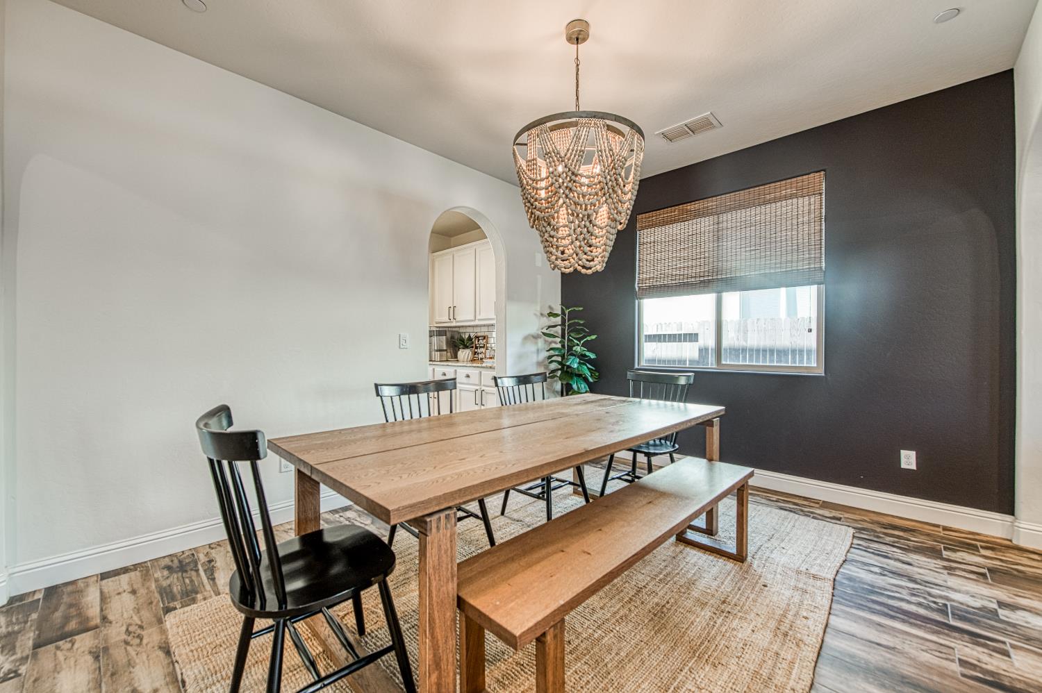 753 East Aretha Avenue Fowler, CA 93625 - Photo 10 of 61 a view of a dining room with furniture window and wooden floor