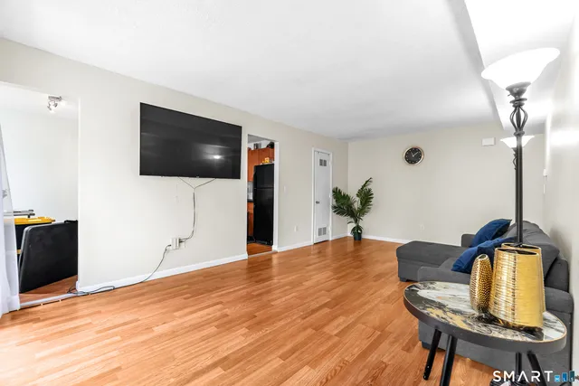 a view of a livingroom with furniture and wooden floor