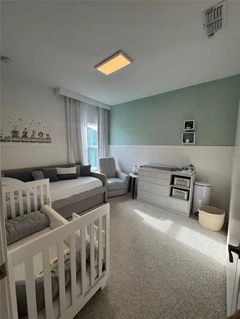 a bedroom with a bed and a couch
