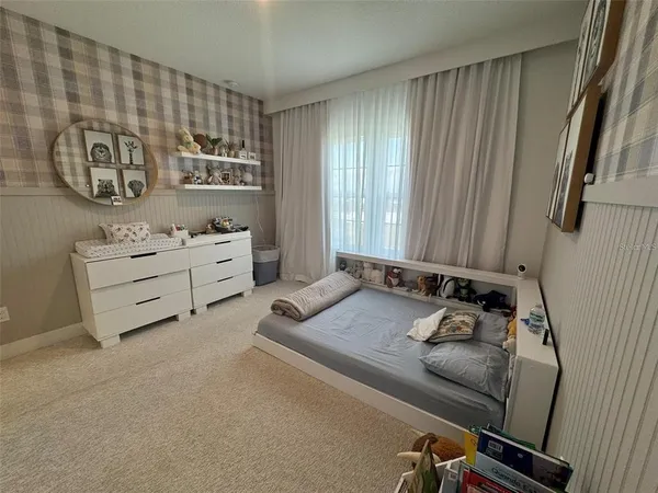 a bedroom with a bed and a table in it