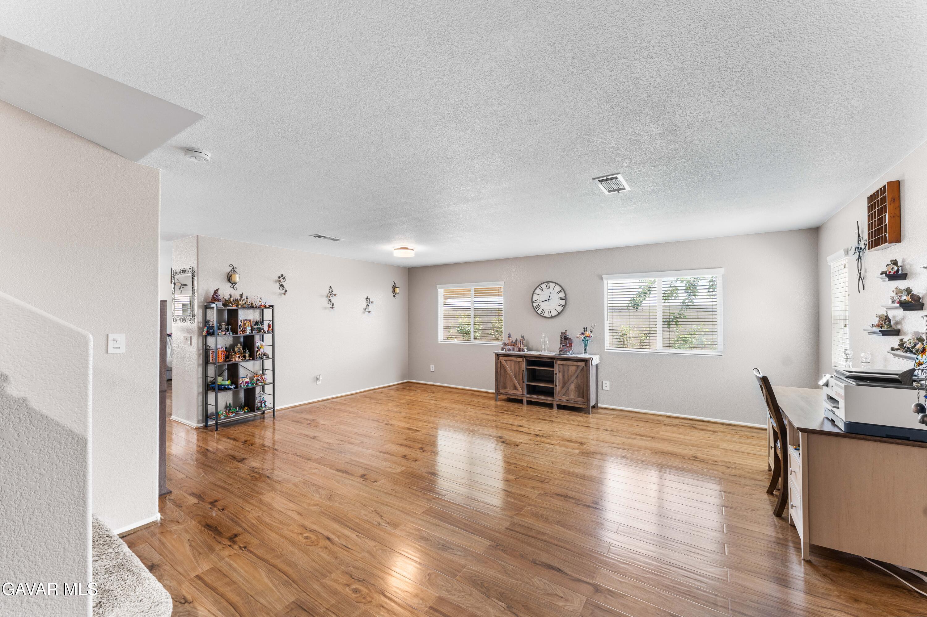 45448 Spahn Lane Lancaster, CA 93535 - Photo 14 of 49 a view of a livingroom with a kitchen and a window