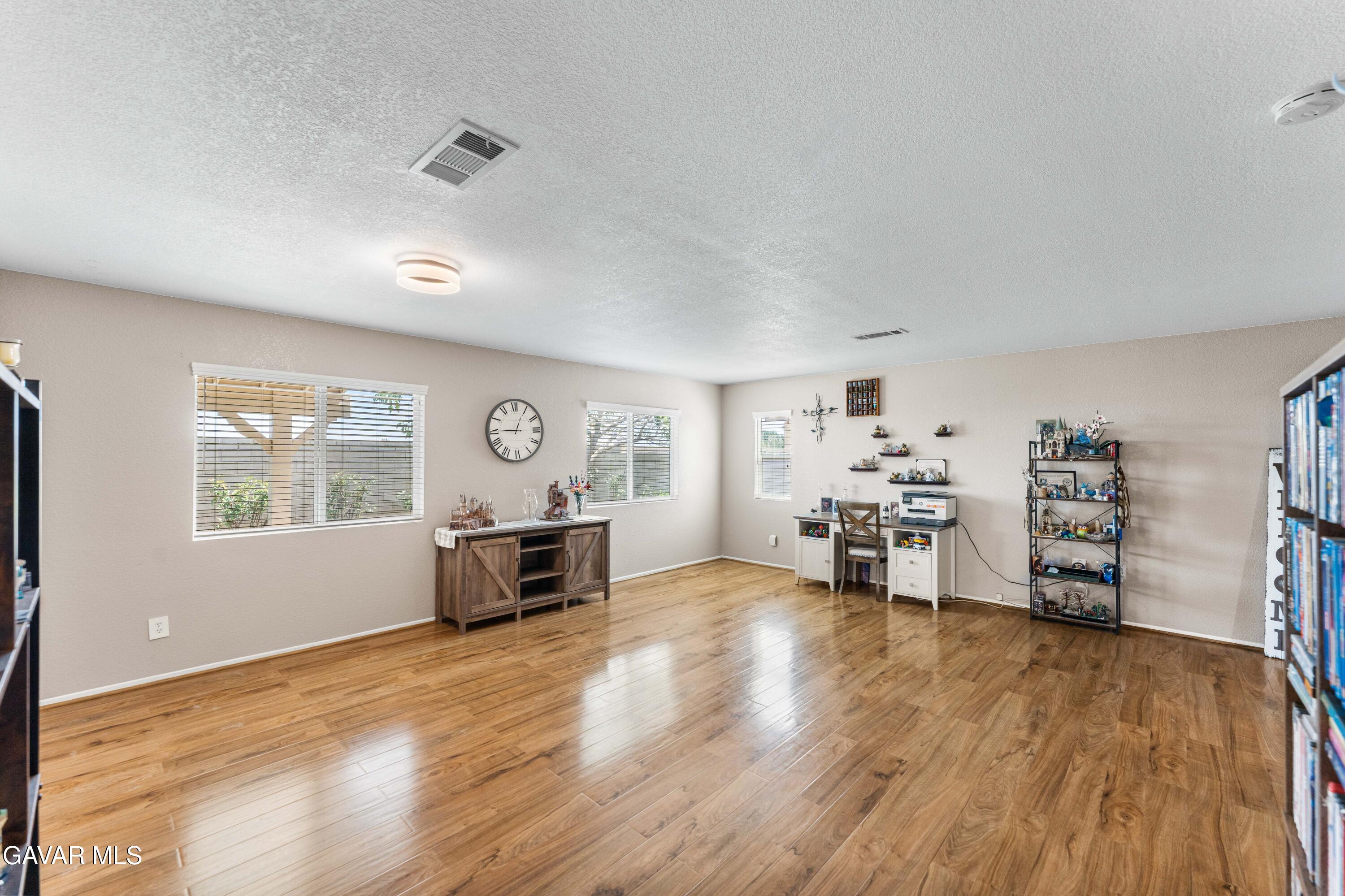 45448 Spahn Lane Lancaster, CA 93535 - Photo 18 of 49 a living room with furniture and a wooden floor