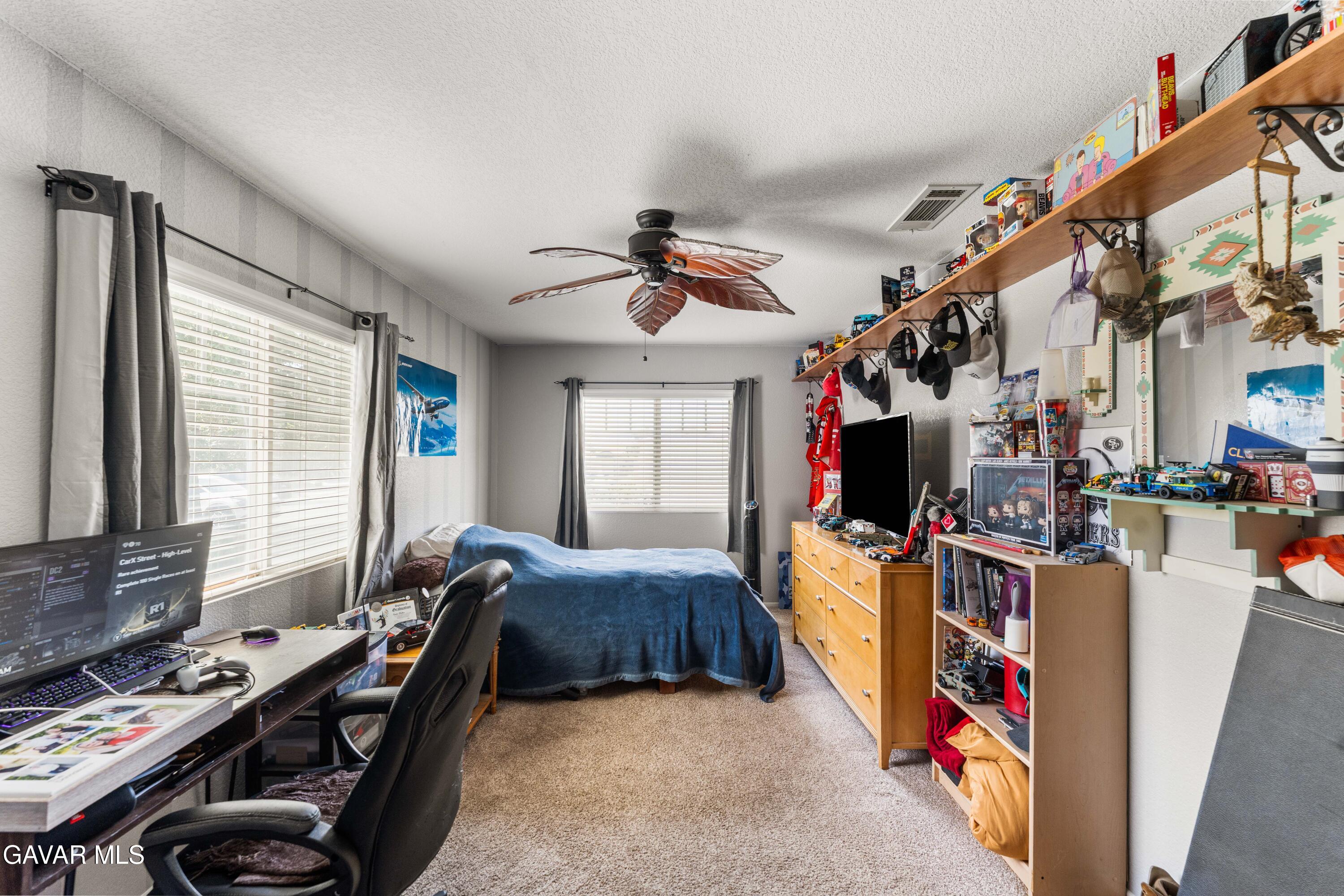45448 Spahn Lane Lancaster, CA 93535 - Photo 19 of 49 a living room with lots of furniture and a window