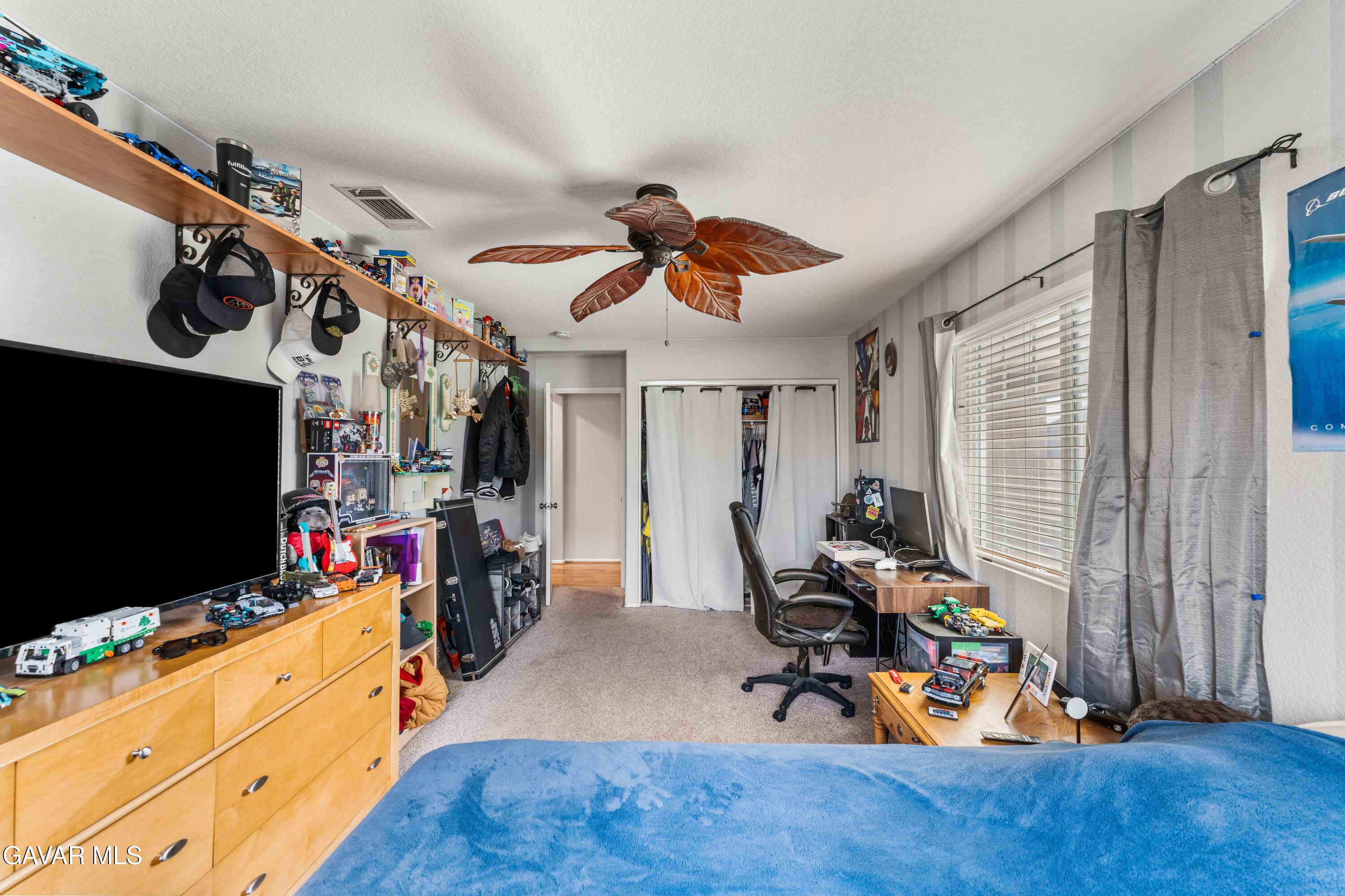 45448 Spahn Lane Lancaster, CA 93535 - Photo 20 of 49 a living room with furniture and a flat screen tv