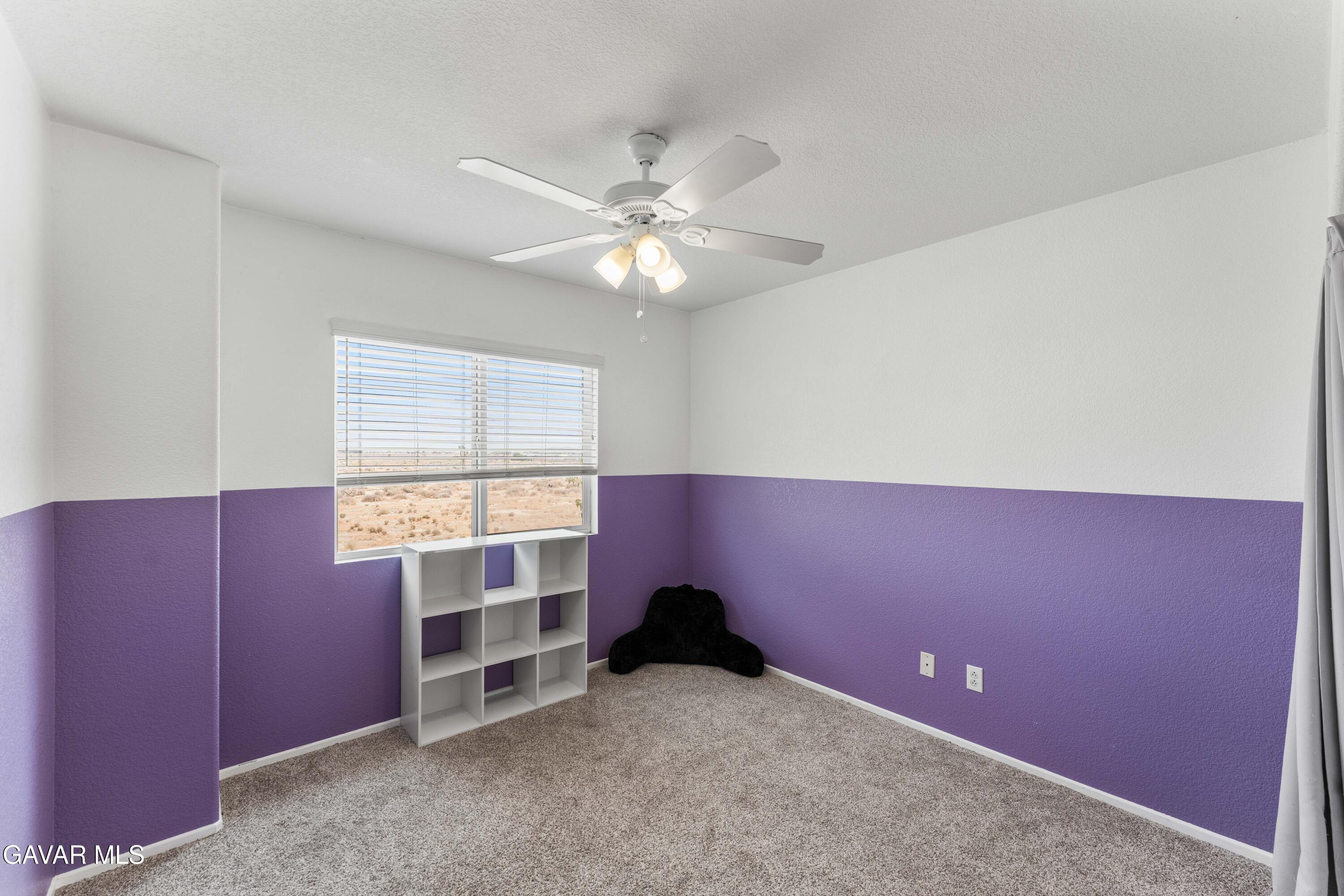 45448 Spahn Lane Lancaster, CA 93535 - Photo 22 of 49 an empty room with windows and fan