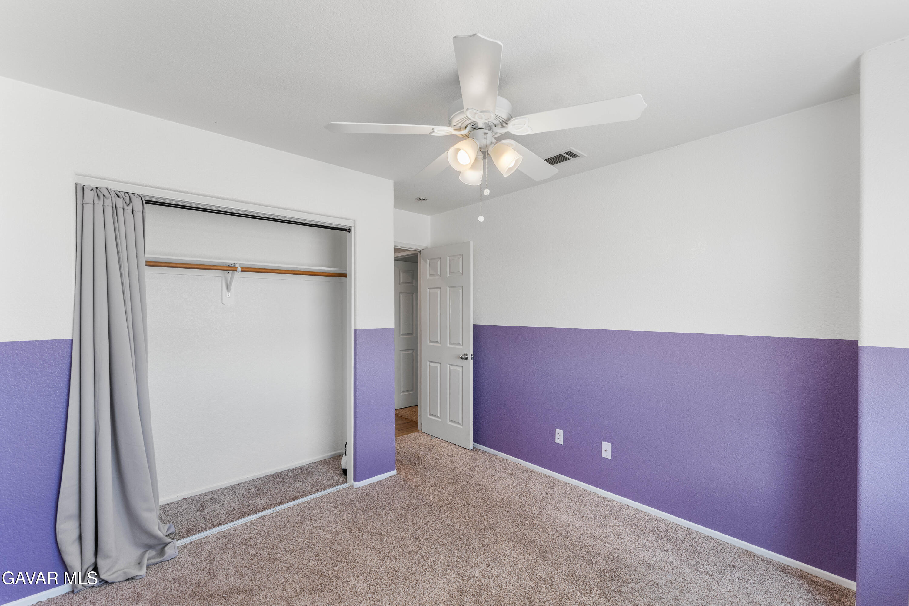 45448 Spahn Lane Lancaster, CA 93535 - Photo 23 of 49 an empty room with closet and a ceiling fan
