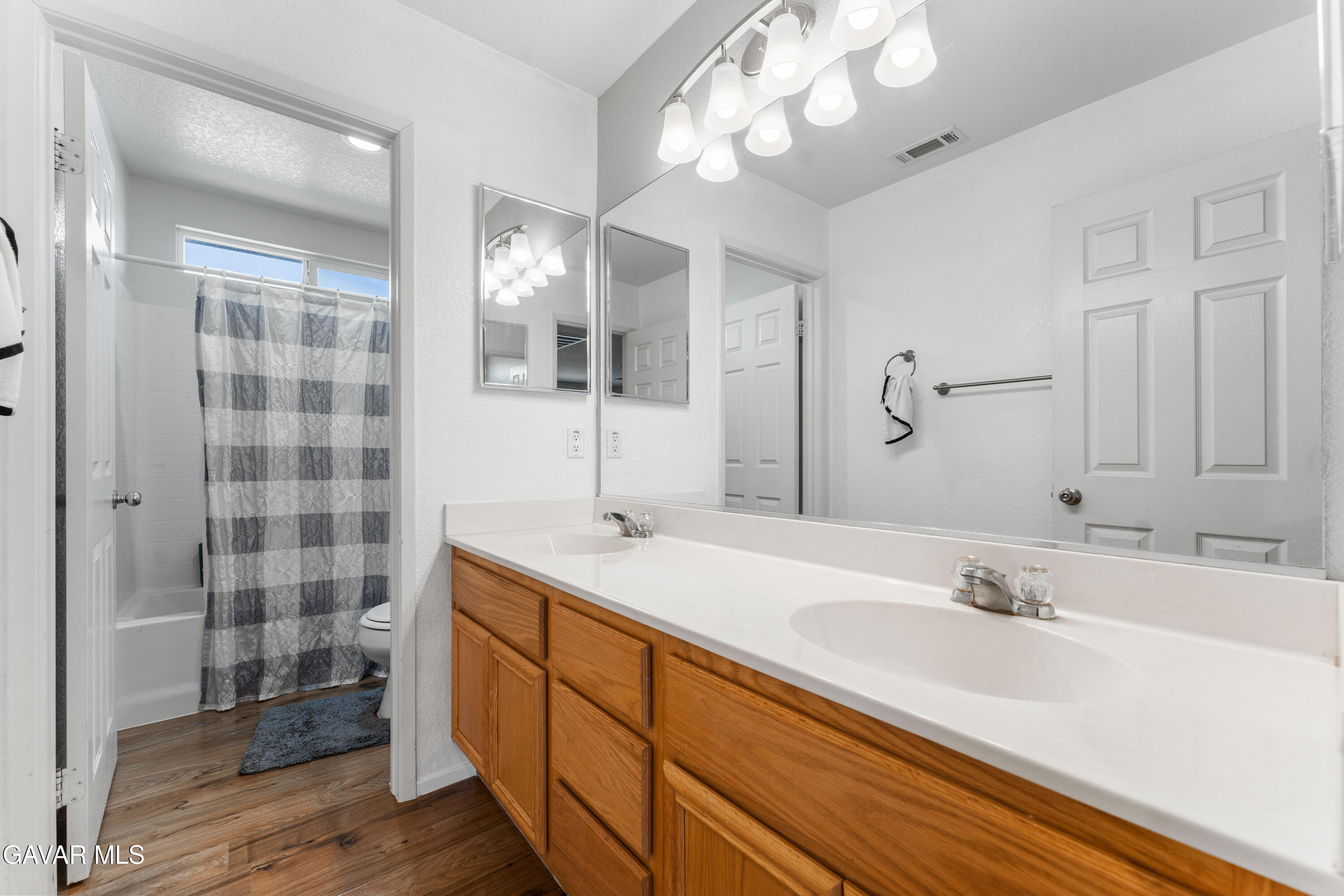 45448 Spahn Lane Lancaster, CA 93535 - Photo 29 of 49 a bathroom with a sink double vanity and shower