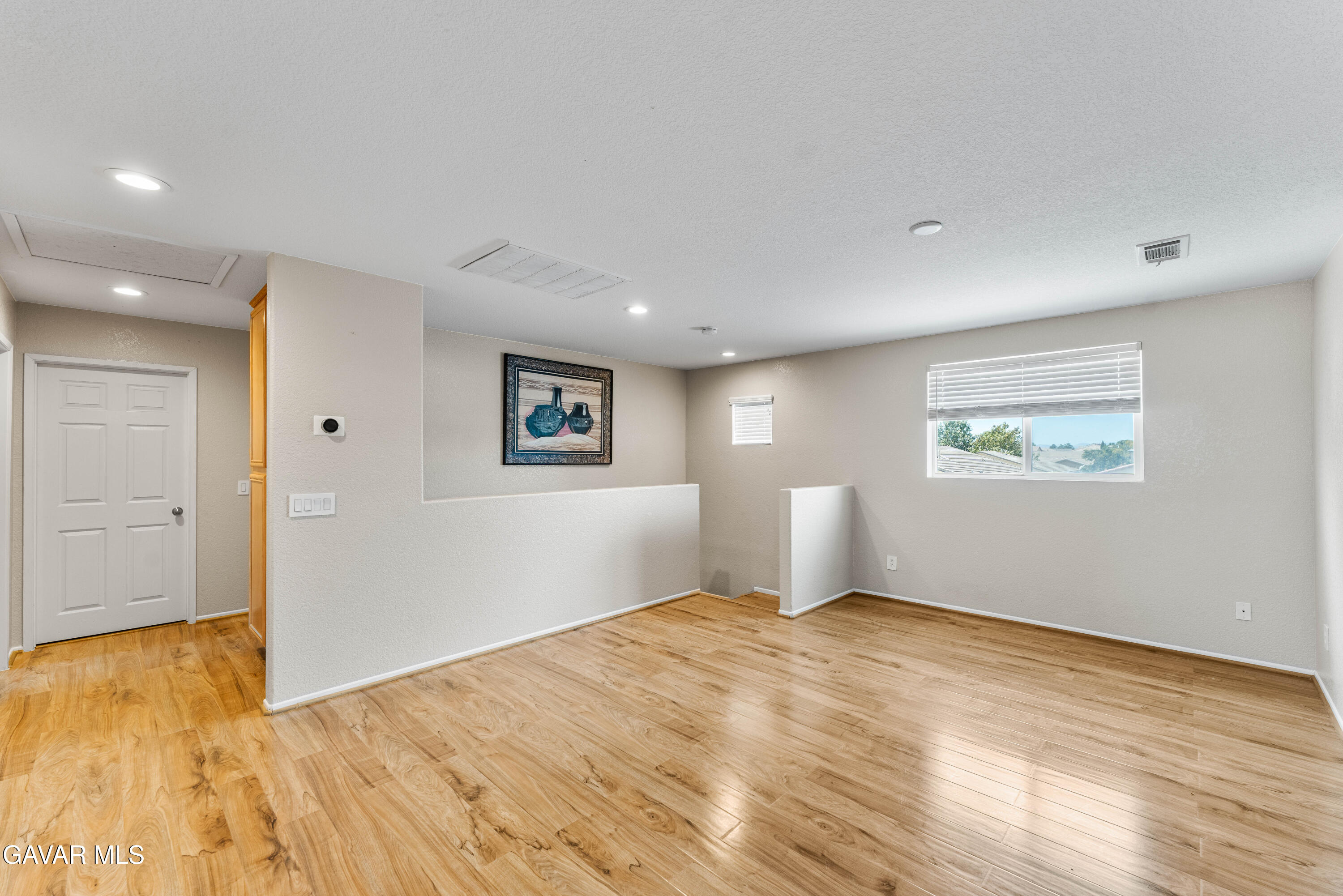 45448 Spahn Lane Lancaster, CA 93535 - Photo 32 of 49 a view of empty room with wooden floor
