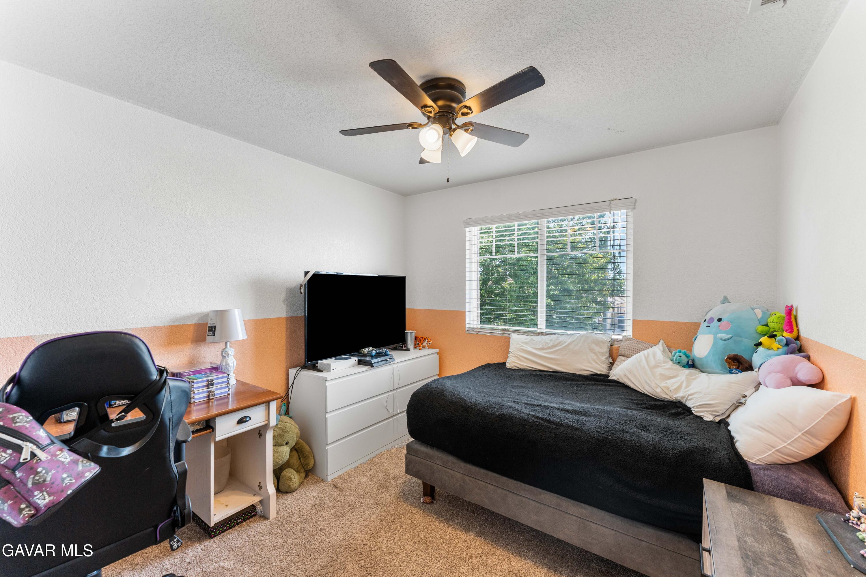 45448 Spahn Lane Lancaster, CA 93535 - Photo 34 of 49 a bedroom with a bed and a window