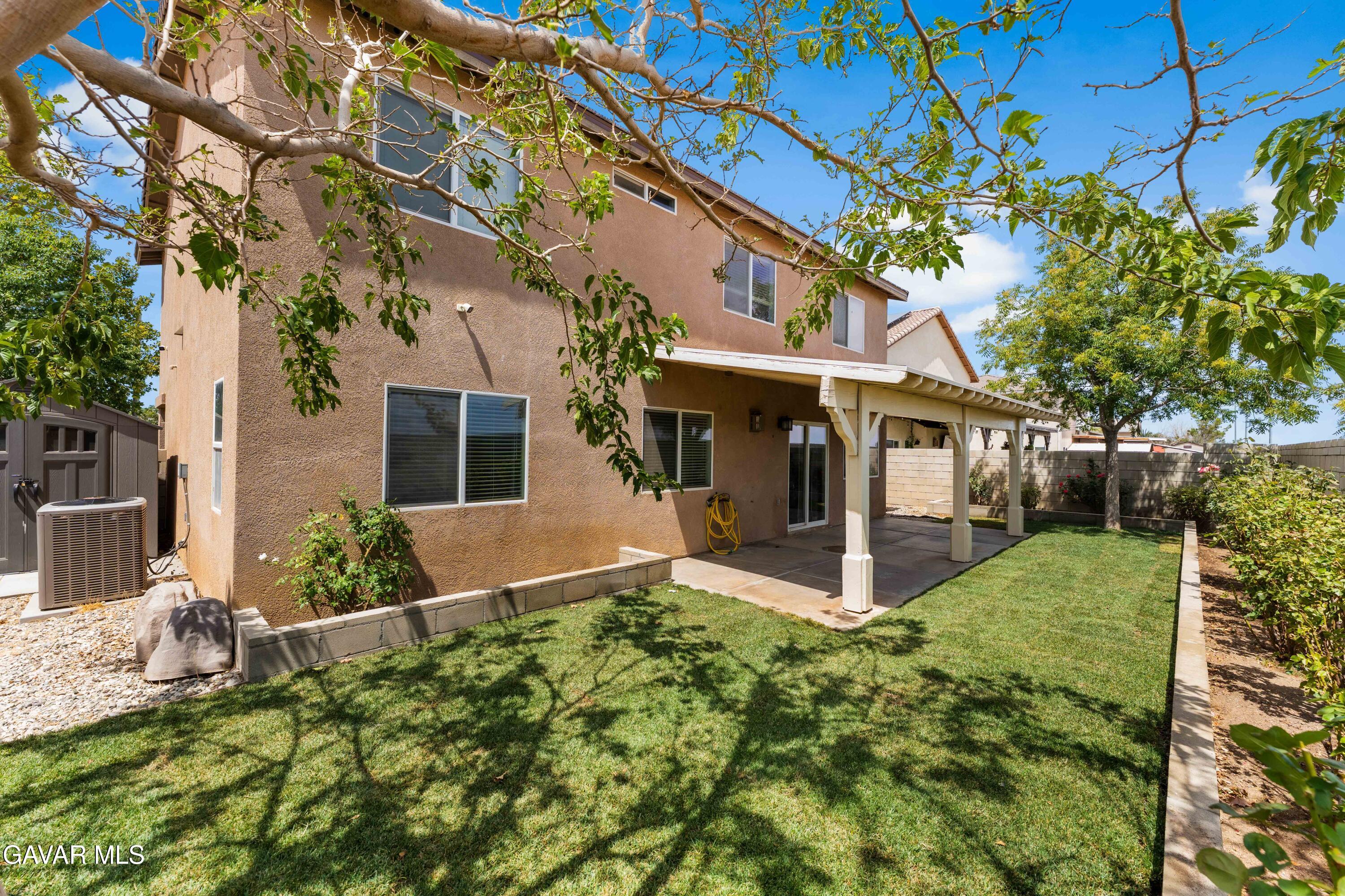 45448 Spahn Lane Lancaster, CA 93535 - Photo 36 of 49 a view of a house with brick walls