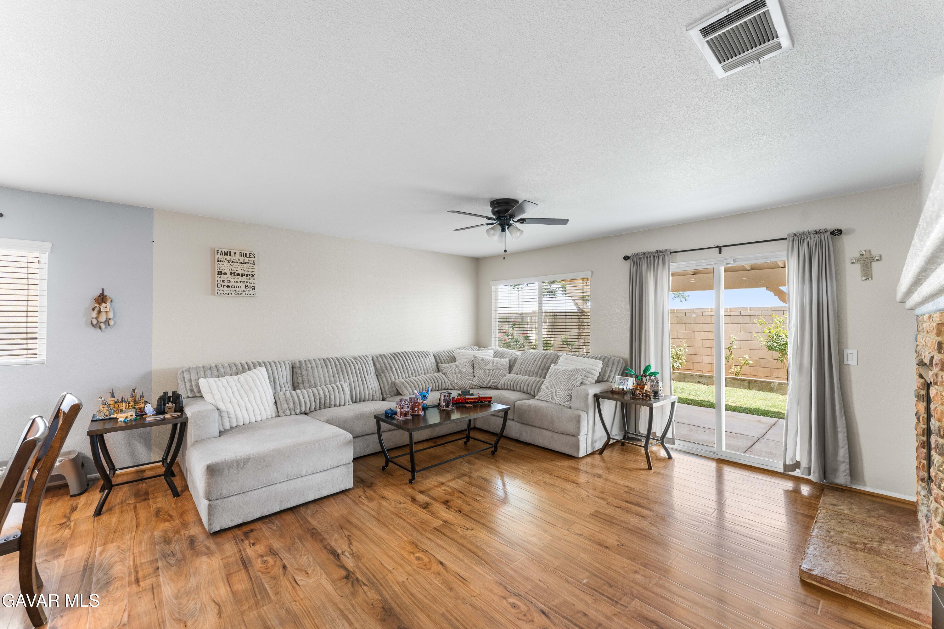 45448 Spahn Lane Lancaster, CA 93535 - Photo 4 of 49 a living room with furniture and a large window